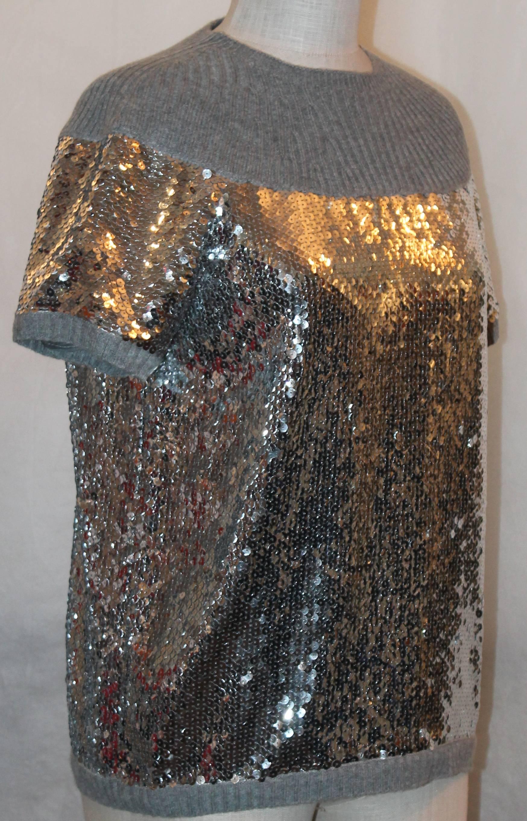 Chanel Grey Cashmere & Silver Sequin Top - 40.  This beautiful top has a cashmere neck and trims.  It has full sequins from the bust to the bottom.  It has a dark rhinestone 