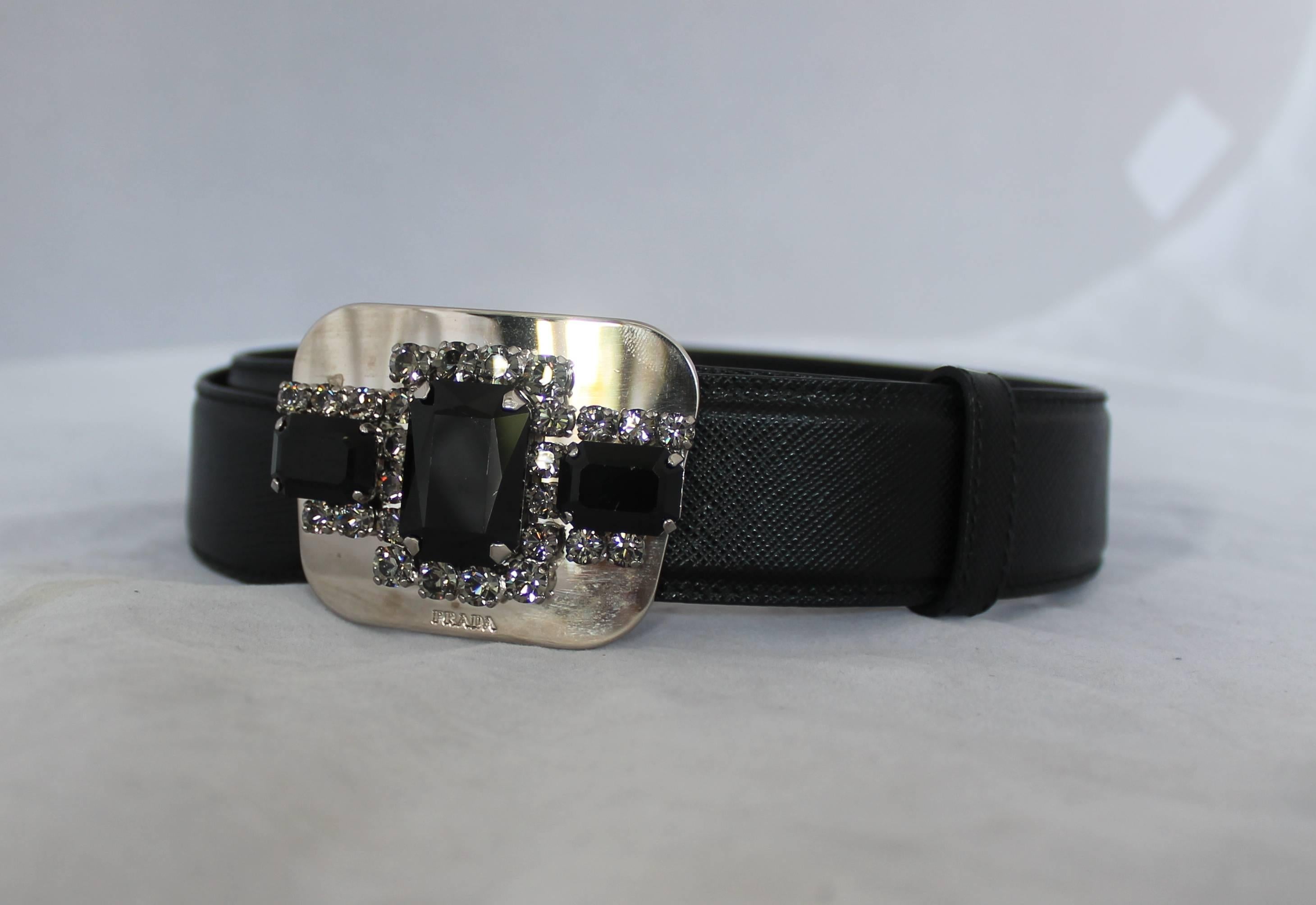 Prada Black Saffiano Belt w/ Silver Rhinestone Buckle - 6
This belt is in very good condition. The buckle is designed with 3 large black rhinestones surrounded with smaller grey rhinestones. However, there is a very minor scratch on center large
