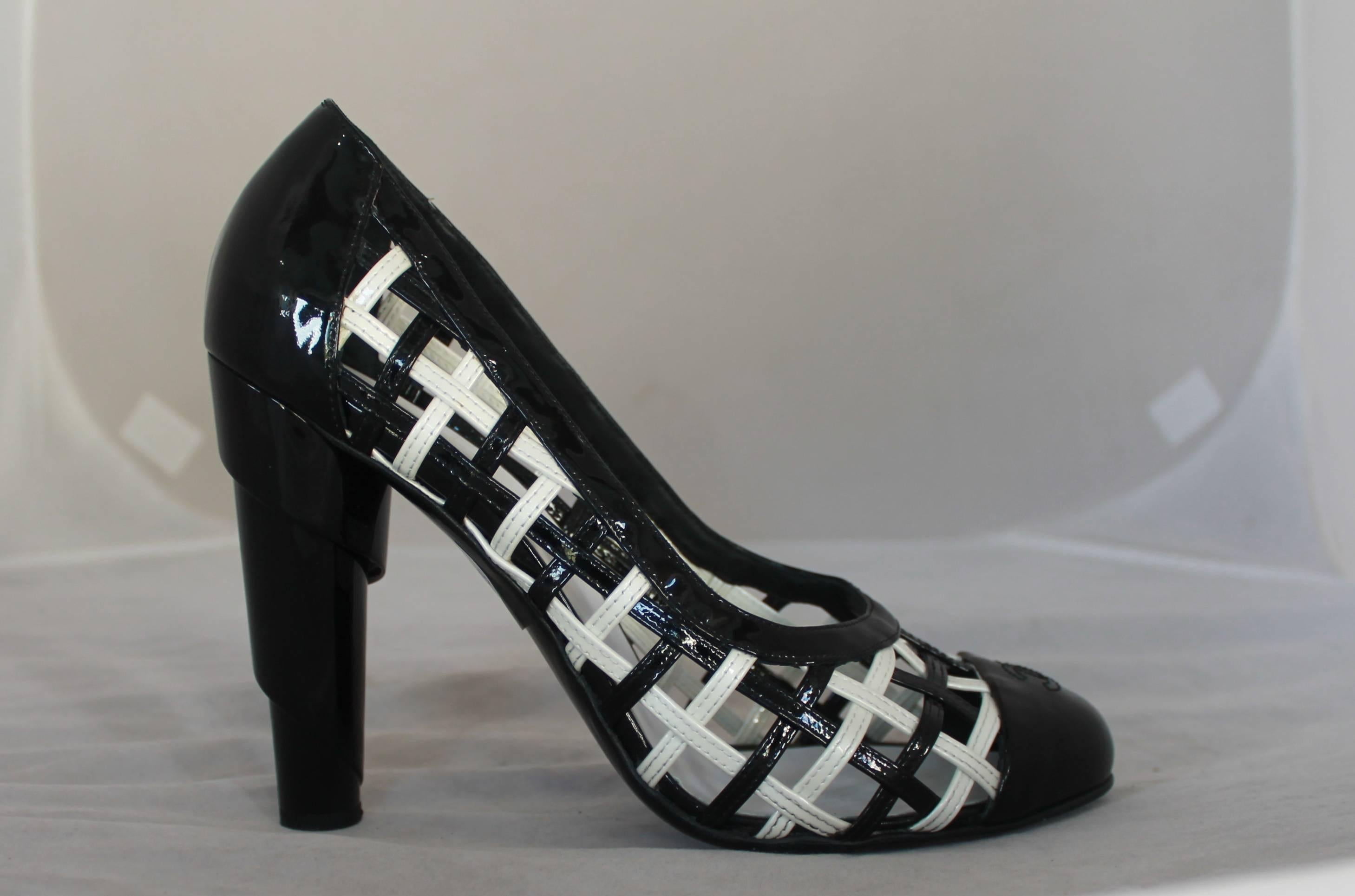 Chanel Black & White Patent Crisscross Pumps w/ Black Toe - 40.5.  These unique pumps are in excellent condition with very minor wear to the sole.  They have a stitched 