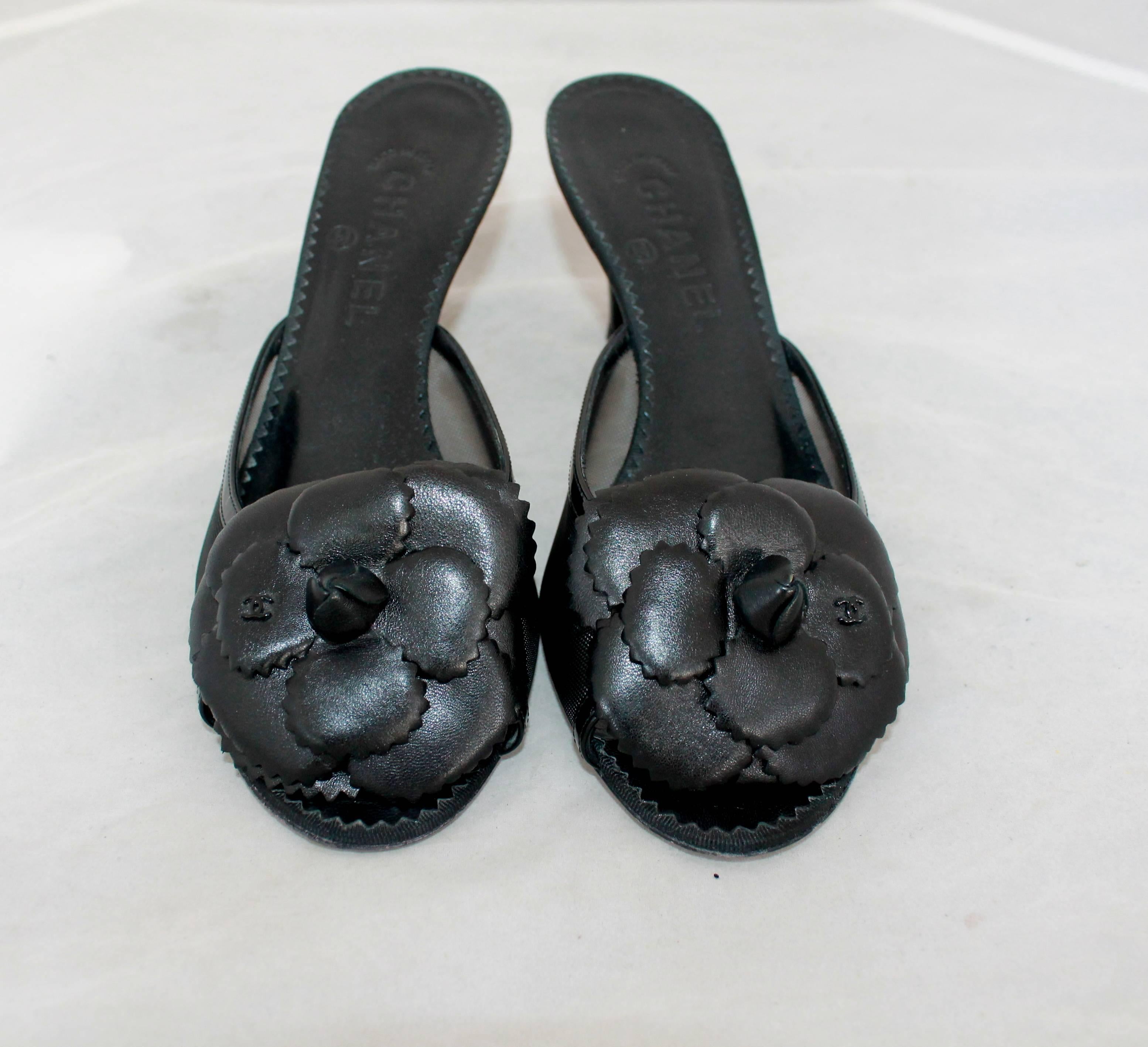 Chanel Black Mesh Slides w/ Patent Trim & Leather Camellia - 39.5.  These mesh slides are in excellent condition with some wear on the sole.  Each shoe has a black leather Camellia with the 