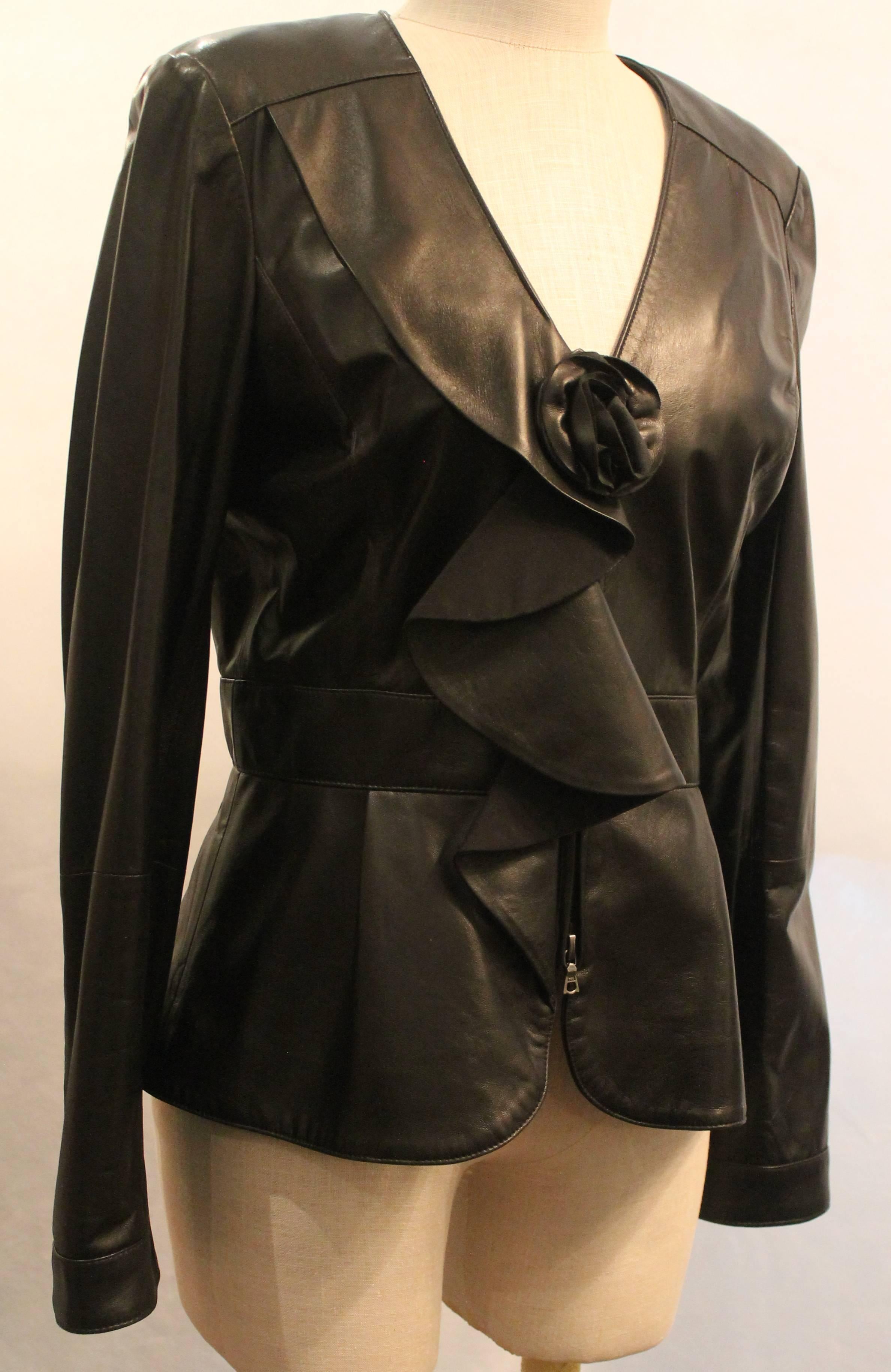 Oscar De La Renta Black Leather Zip front Jacket w/ Ruffle and Flower Detail - 10 The jacket is NEW WITH TAGS. and retailed for $2,490 in 2011. This jacket is fully lined in silk, has 4 metal snap buttons on each sleeve, is fitted until the waist