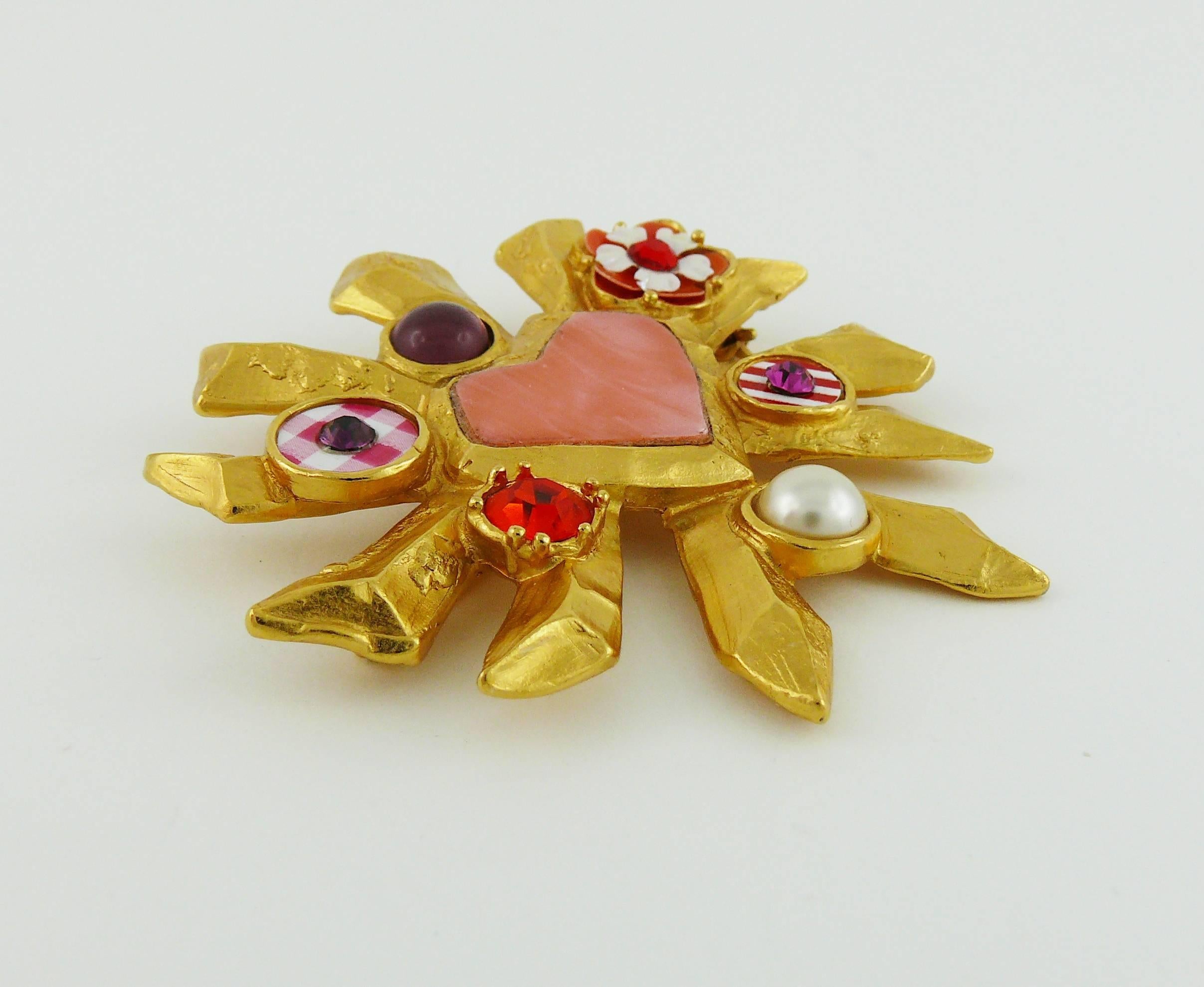 CHRISTIAN LACROIX vintage iconic radiant heart brooch embellished with faux pearl, multi colored crystals, glass cabochon and rhodoid details.

Marked CHRISTIAN LACROIX CL Made in France.

JEWELRY CONDITION CHART
- New or never worn : item is in
