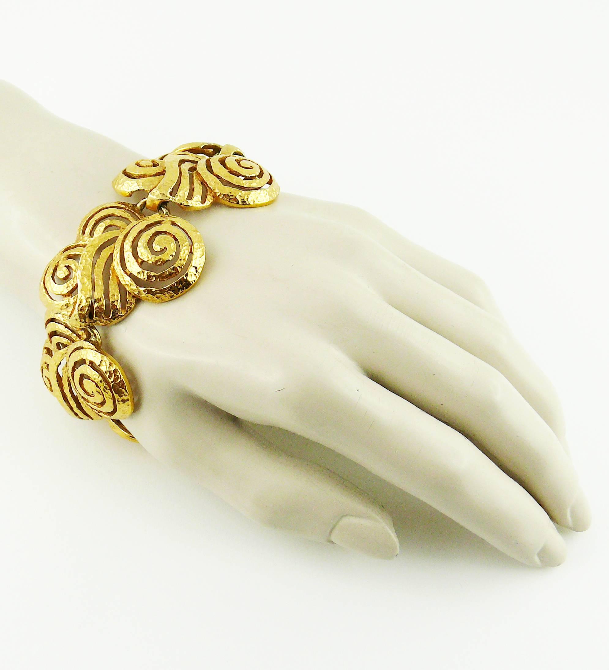 LANVIN vintage gold tone Art Deco style articulated bracelet featuring beautiful textured openwork links.

T bar closure.

Embossed LANVIN Germany.

JEWELRY CONDITION CHART
- New or never worn : item is in pristine condition with no noticeable