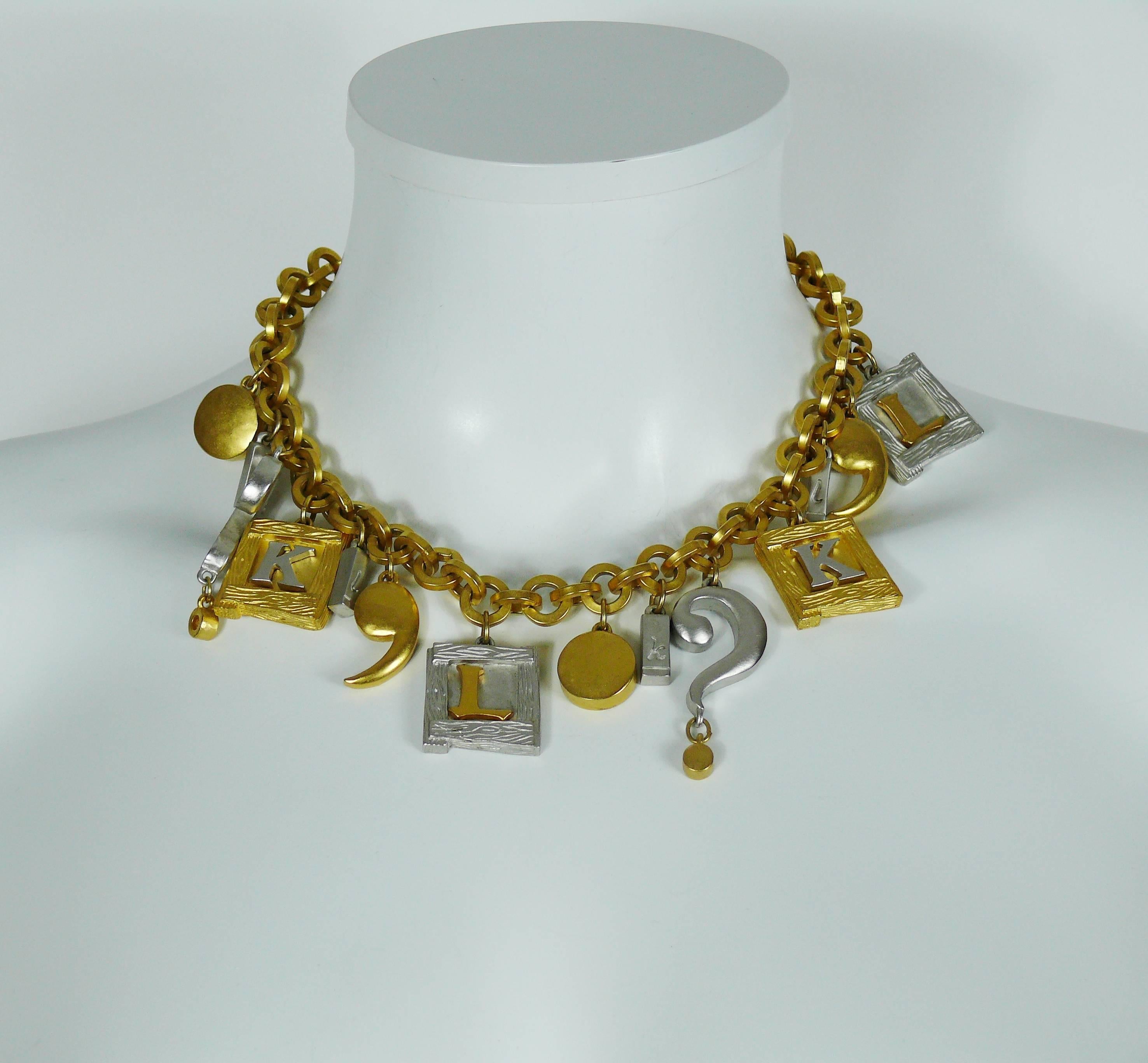 KARL LAGERFELD beautiful vintage gold tone chunky chain necklace featuring various charms : initials, dots, question marks...

Marked KL.

Indicative measurements : total length approx. 48 cm (18.90 inches) / adjustable length from approx. 43 cm