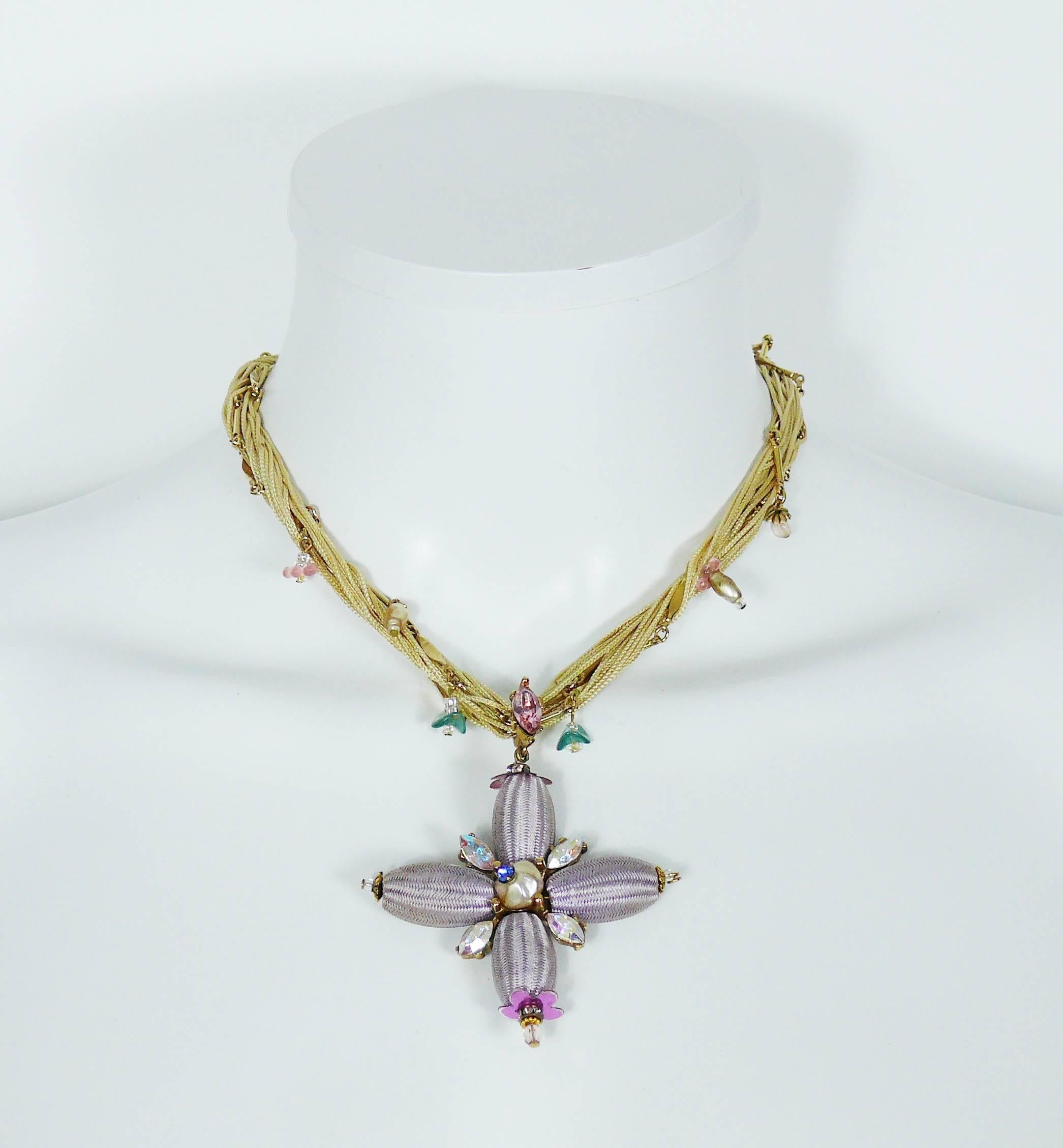 CHRISTIAN LACROIX vintage pendant necklace featuring a beautiful cross made of olive shaped woven silk branches embellished with faux pearl and multicolored crystals. 

Off white silk cord rope interweaved with gold tone chain and charms.

Lobster