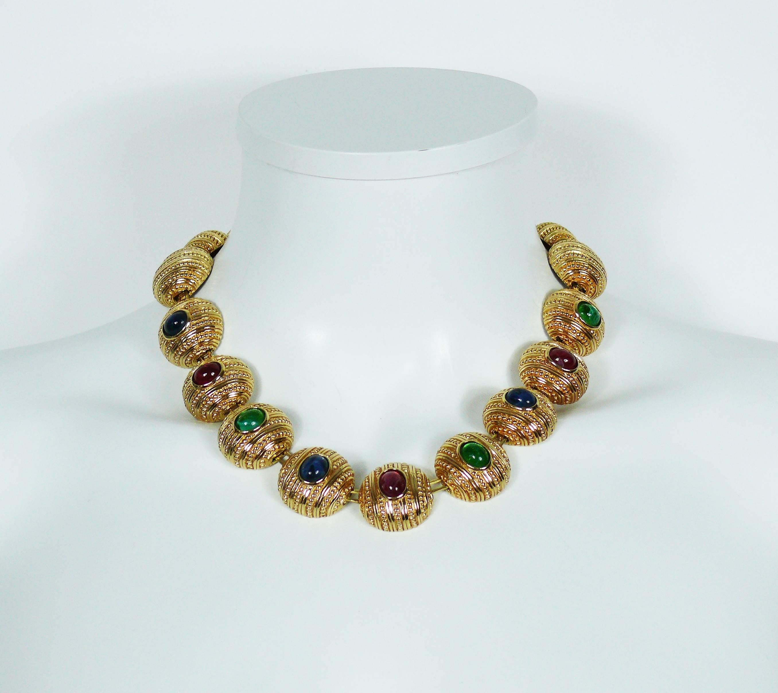 CHRISTIAN DIOR vintage gold tone necklace featuring round domed links embellished with multicolored faux gemstone poured glass cabochons.

Lobster clasp closure.
Extension chain.

Marked CHR. DIOR Germany.

Indicative mesaurements : total length
