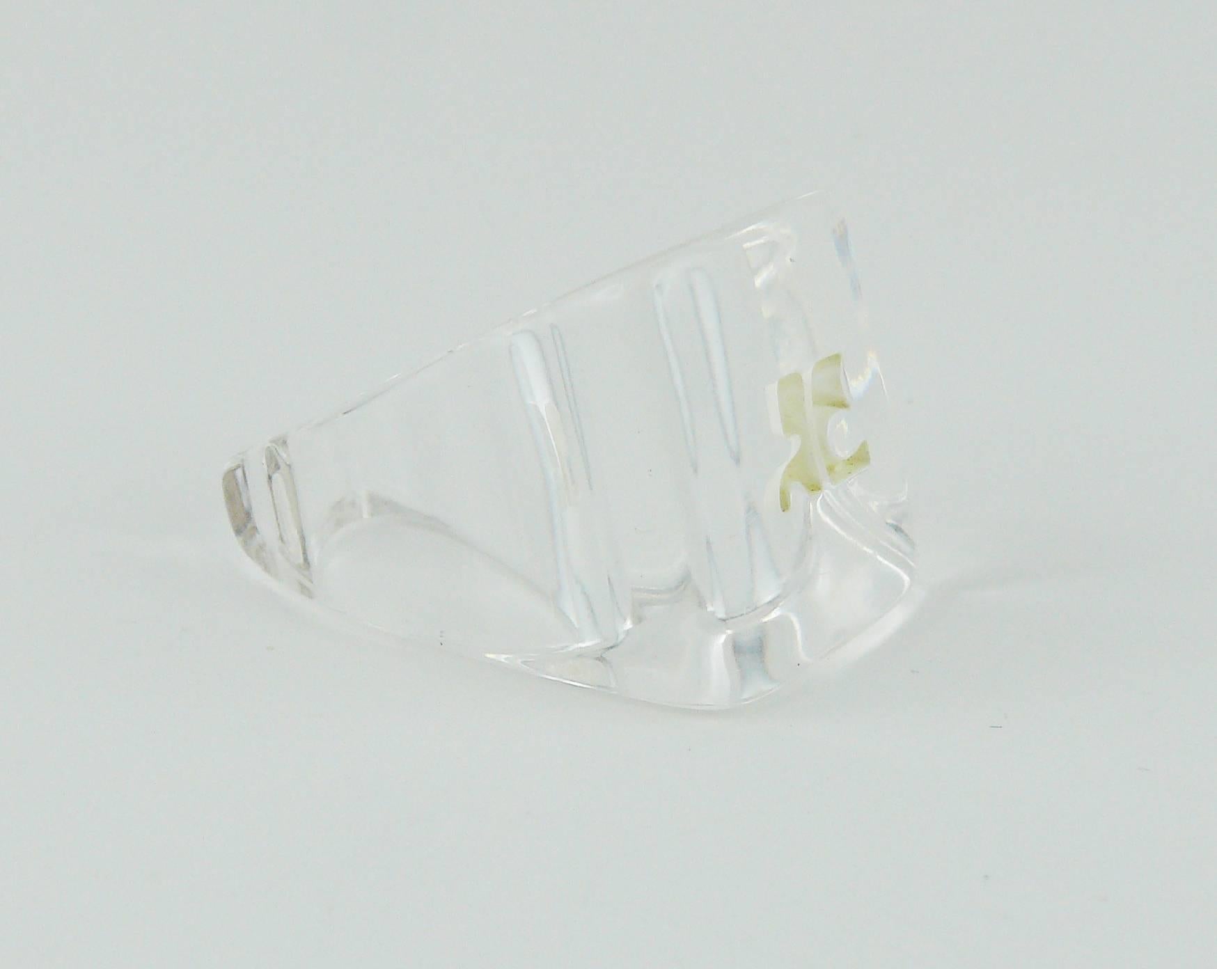 ANDRE COURREGES vintage clear lucite "ice cube" ring featuring white intaglio A. COURREGES monogram.

Indicative mesaurements : inner circumference approx. 5.34 cm (2.10 inches).

We estimate this ring to be a French 57 size / US 8