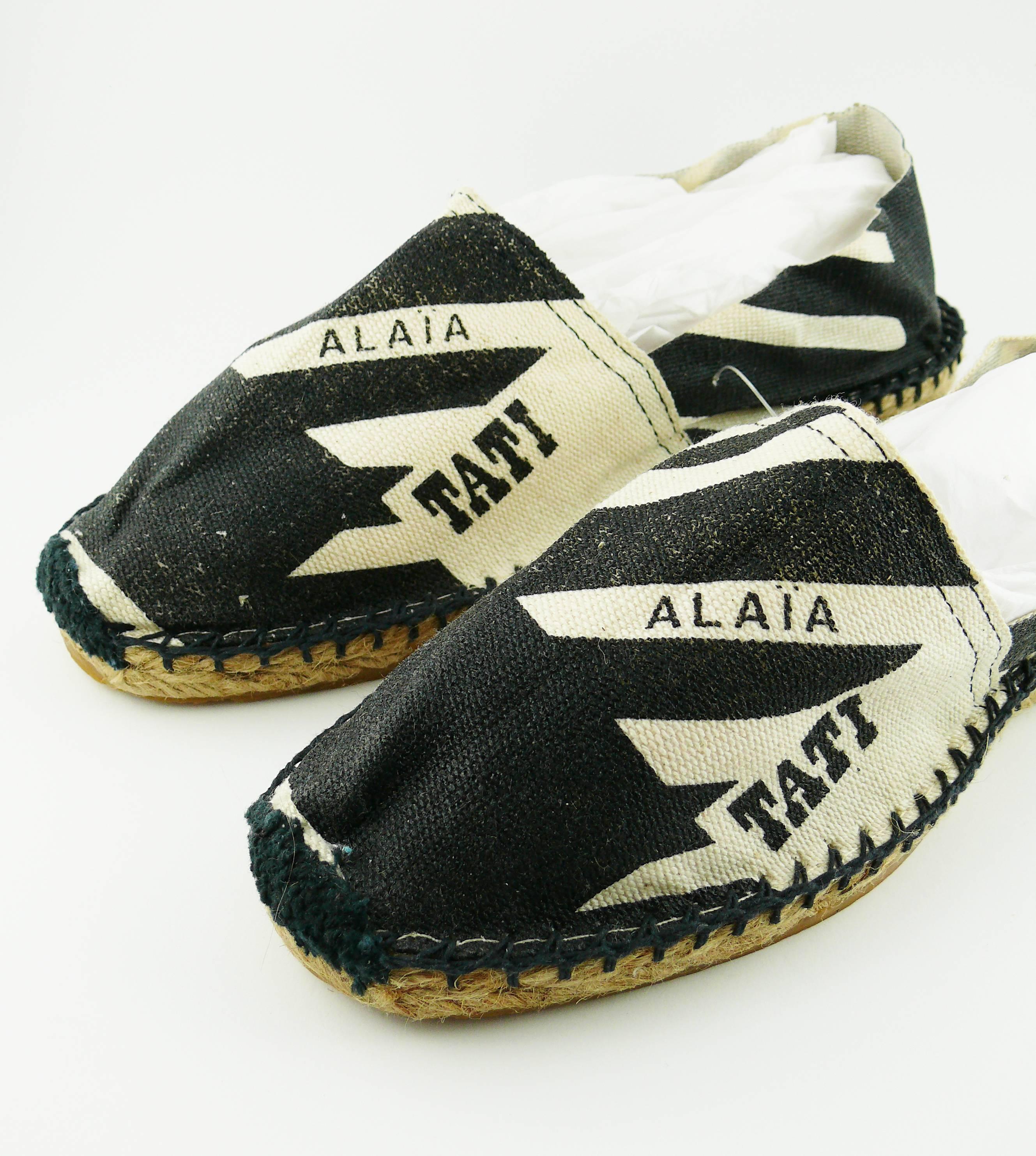 ALAIA for TATI early 1990s iconic navy blue and off-white hound's tooth canvas espadrilles. 

Unworn condition (including flaws). 

A very rare and collectable find !

Fashion designer AZZEDINE ALAIA worked for TATI in the early 90's and