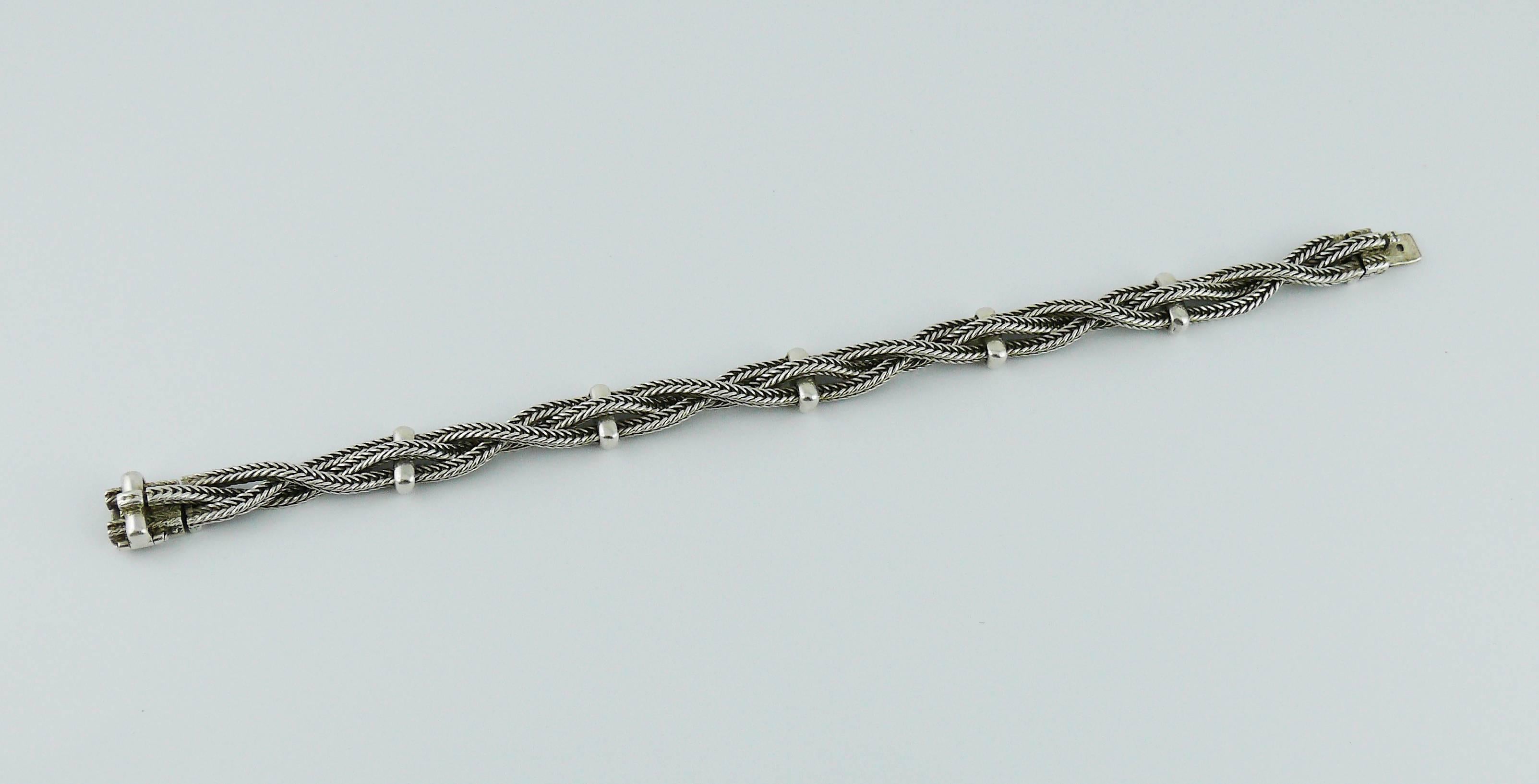 HERMES vintage rare sterling silver bracelet featuring a gorgeous intertwined rope design.

Embossed HERMES.
French silver hallmark 