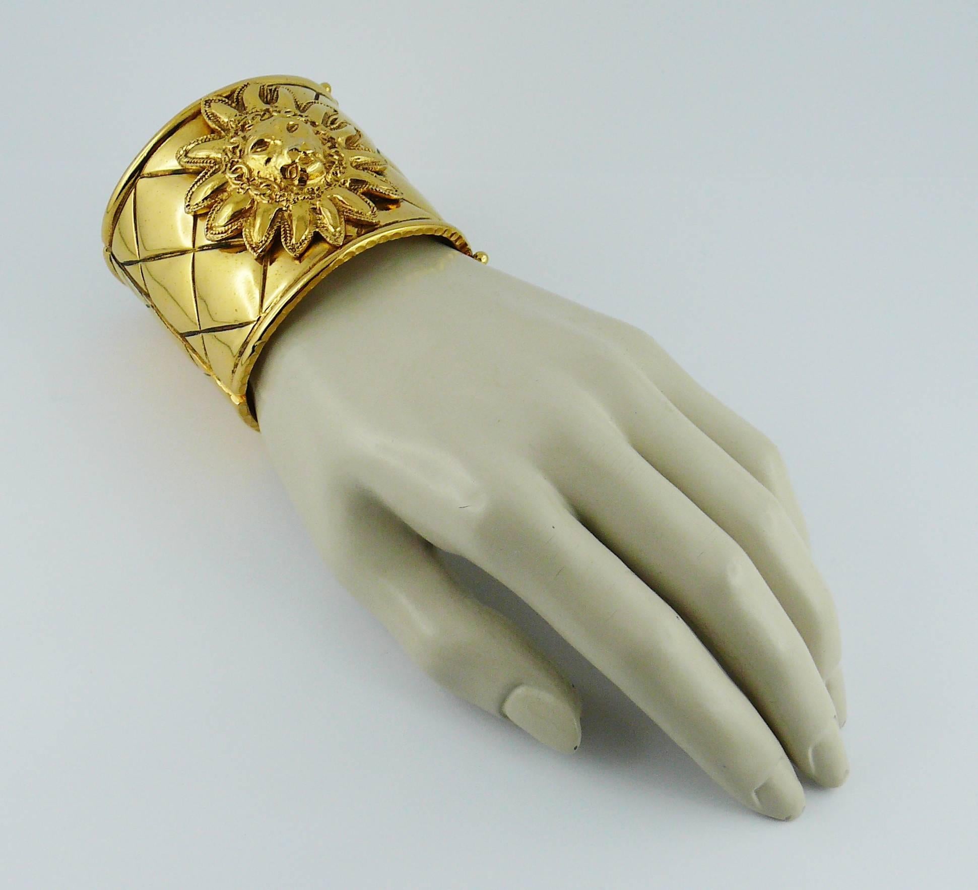 CHANEL vintage iconic cuff bracelet featuring a quilted pattern with an applied lion head in the center.

Two safety latches closure.

Marked CHANEL Made in France.
Engraved with the 