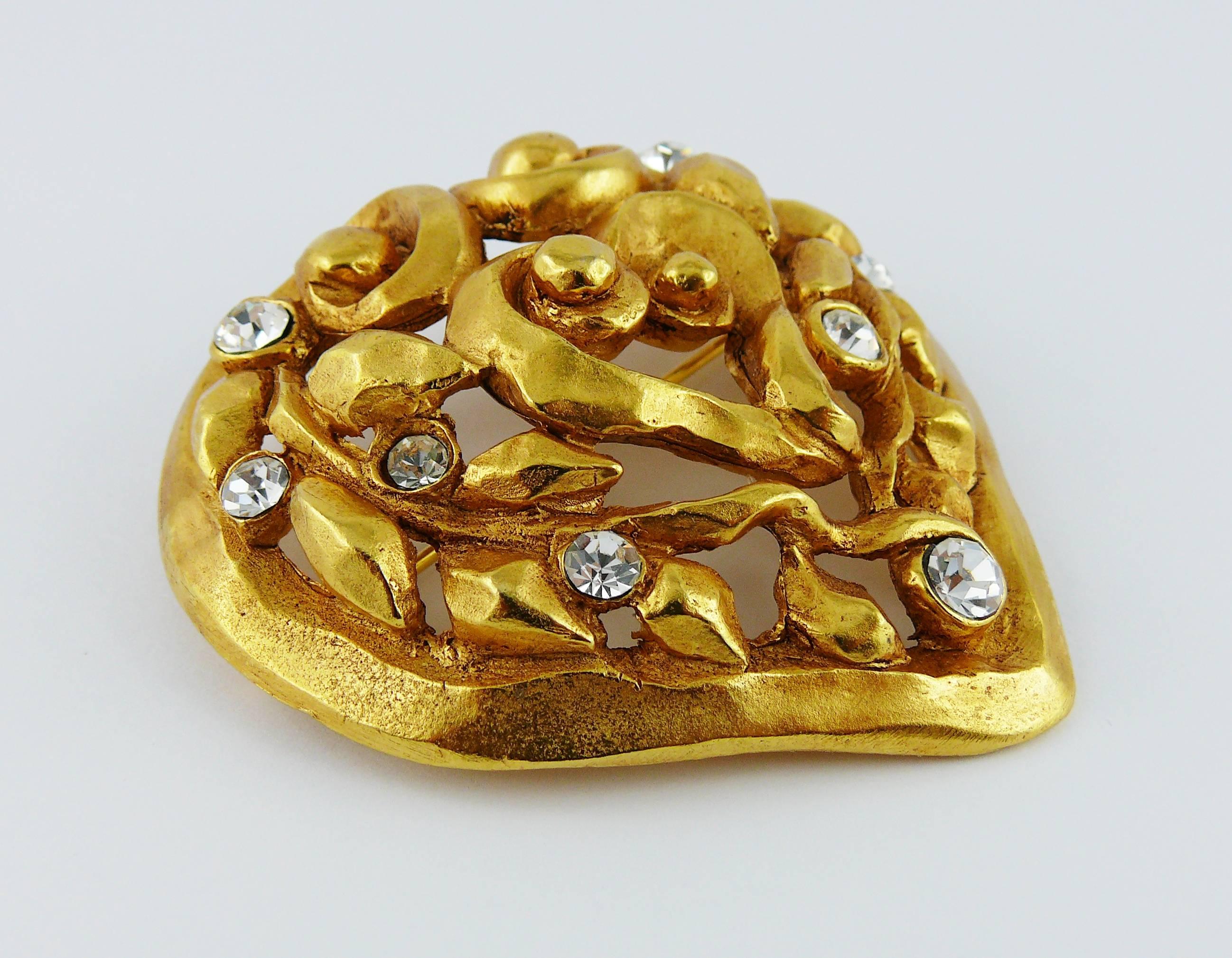 CHRISTIAN LACROIX vintage gorgeous gold tone heart brooch featuring an openwork abstract 3-D foliage design embellished with clear crystals.

Christmas 1991 limited edition.

Marked CHRISTIAN LACROIX CL Made in France.
Embossed "Noël  91