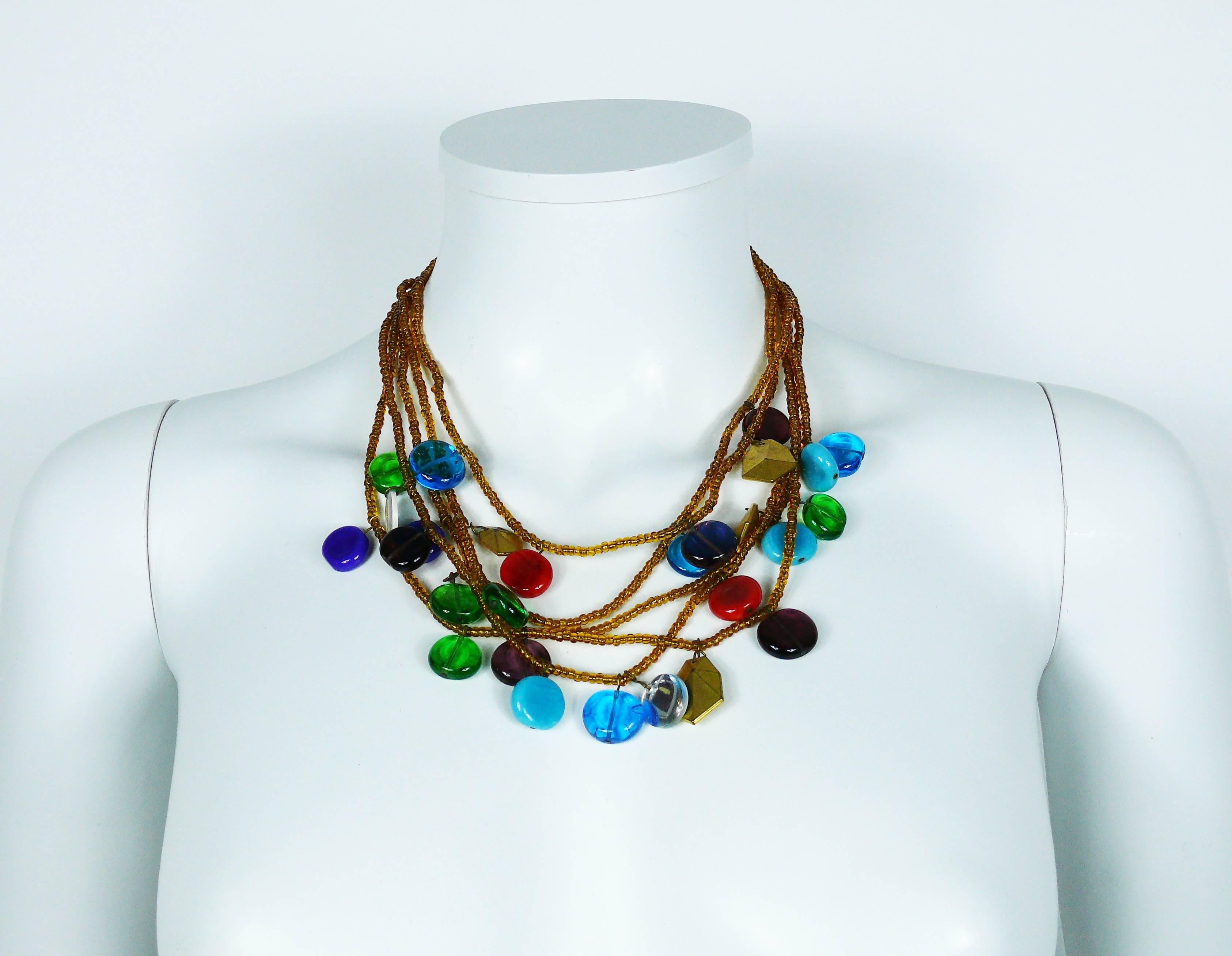 YVES SAINT LAURENT vintage rare multi strand beaded necklace featuring multicolored pate de verre, mirrored and gold toned charms.

This is an early YVES SAINT LAURENT piece of costume jewelry, most probably from the 70s-80s.

Gorgeous blue poured