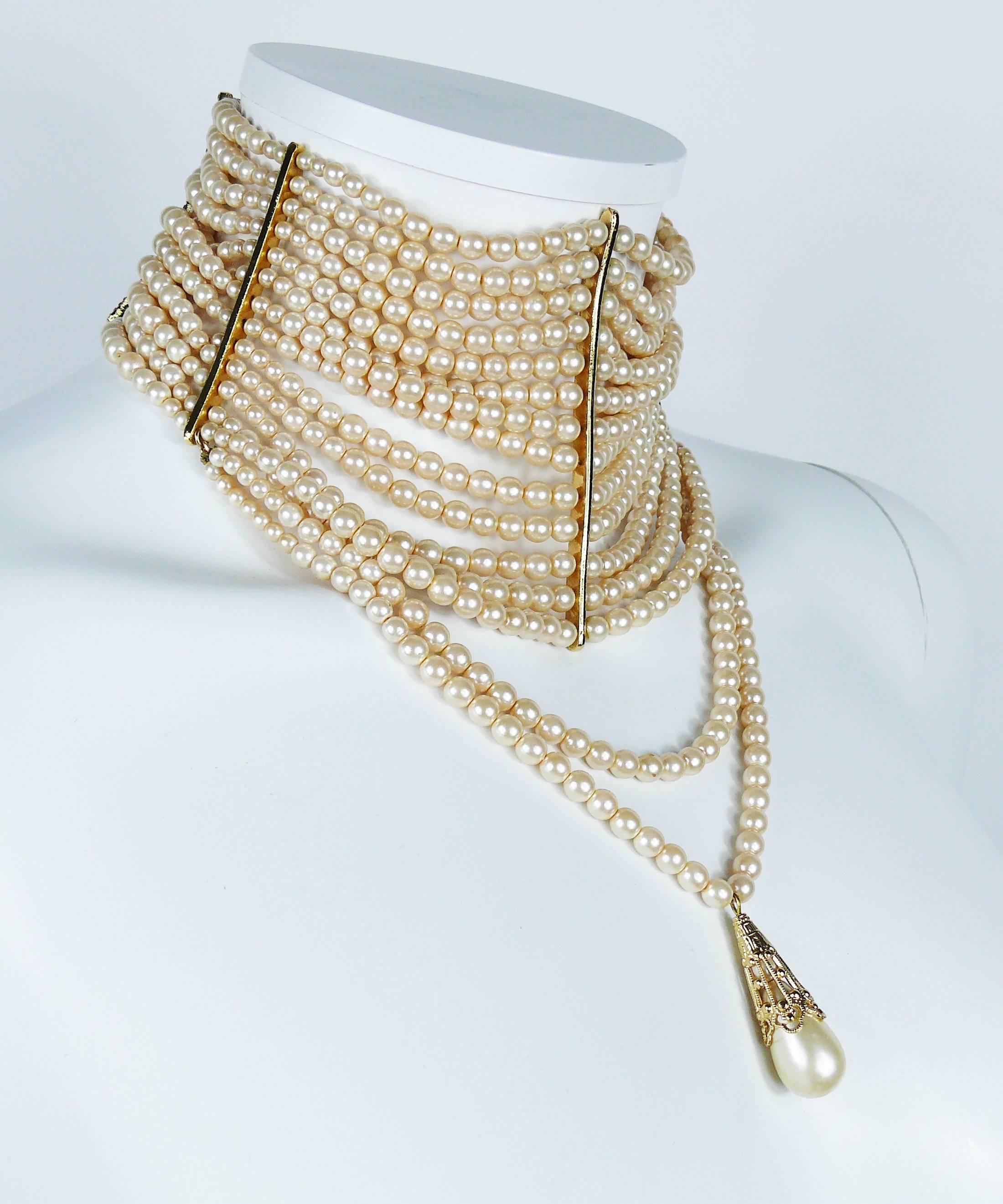 CHRISTIAN DIOR multi strand iconic Edwardian inspired couture pearl choker necklace.

This necklace features :
- 15 off-white glass pearl strands
- A large pearl drop.
- Gold toned setting.
- Hook clasps
- Extension chains.

Embossed