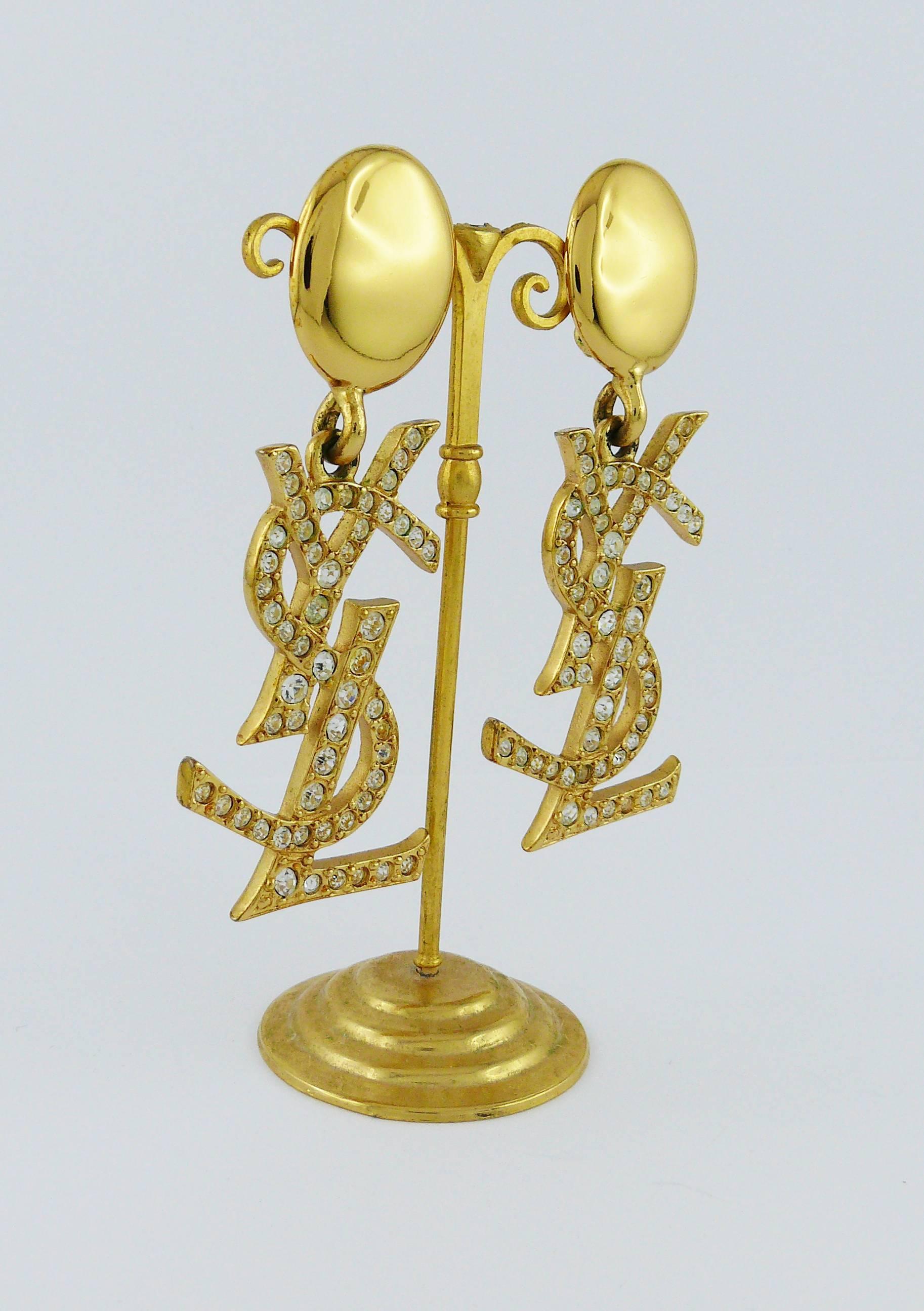YVES SAINT LAURENT vintage rare massive gold toned dangling earrings (clip-on) featuring YSL monogram embellished with clear crystals.

Marked YSL Made in France.

Indicative measurements : length approx. 8 cm (3.15 inches) / max. width approx. 2.6