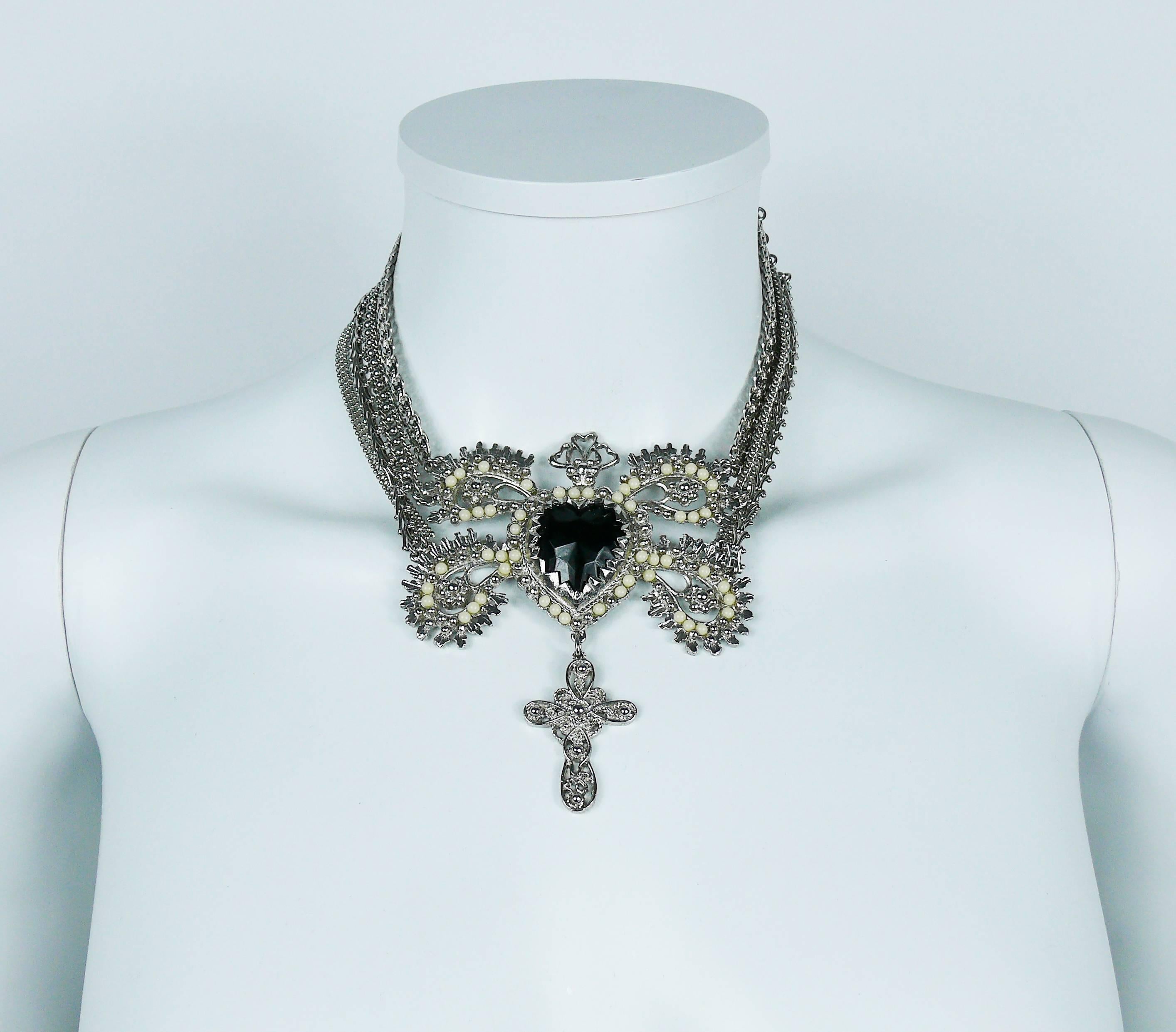 CHRISTIAN LACROIX vintage gorgeous silver toned necklace featuring an ex voto sacred heart, adorned with boteh-like design, embellished with a large black glass cabochon and off-white pearls.

This necklace also features a cross charm and four