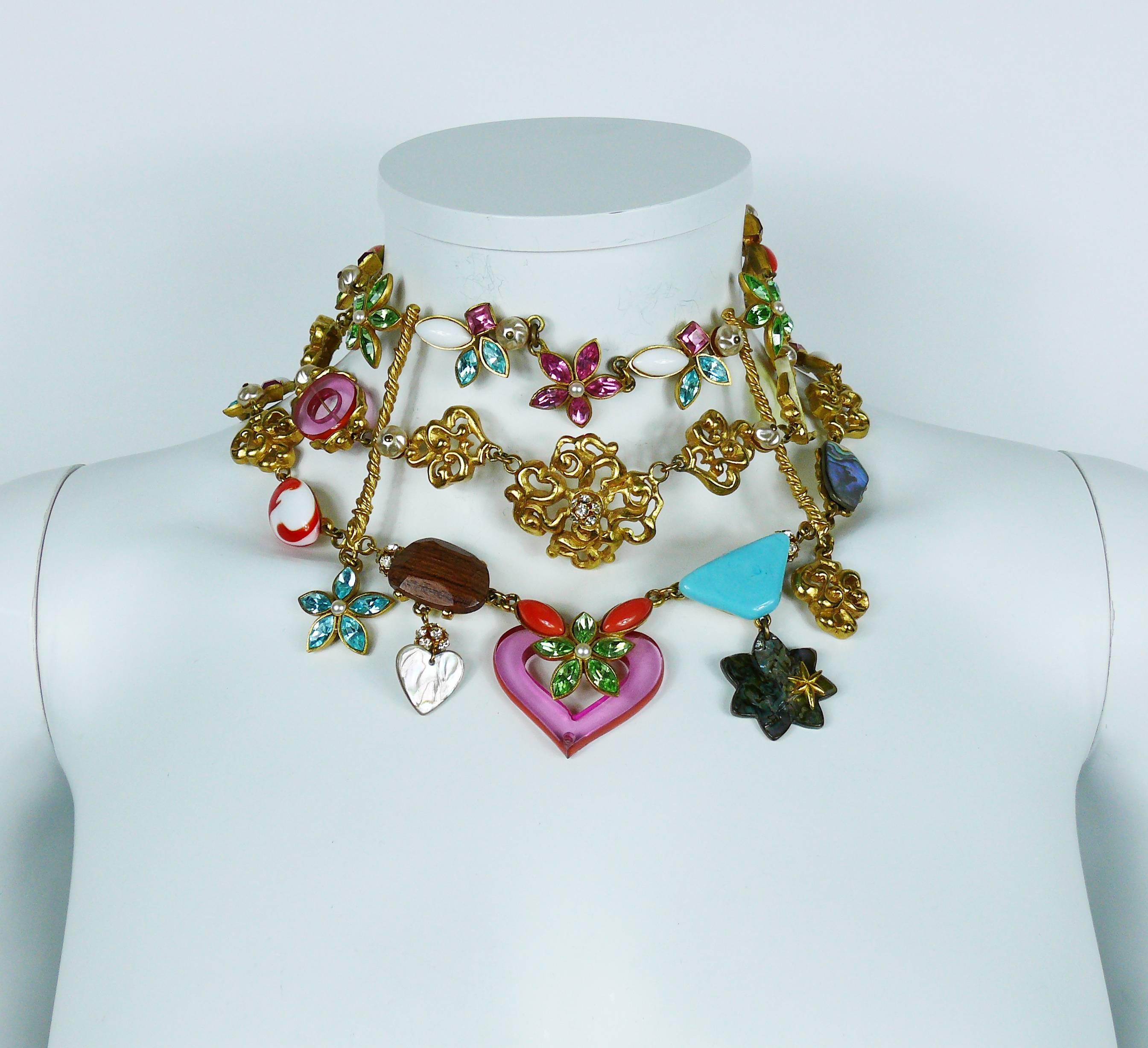 CHRISTIAN LACROIX vintage opulent choker necklace featuring three strands of multicolored crystals, faux pearls, glass cabochons, wood, iridescent mother of pear and lucite elements in a gold toned setting.

T-bar closure.
Extension