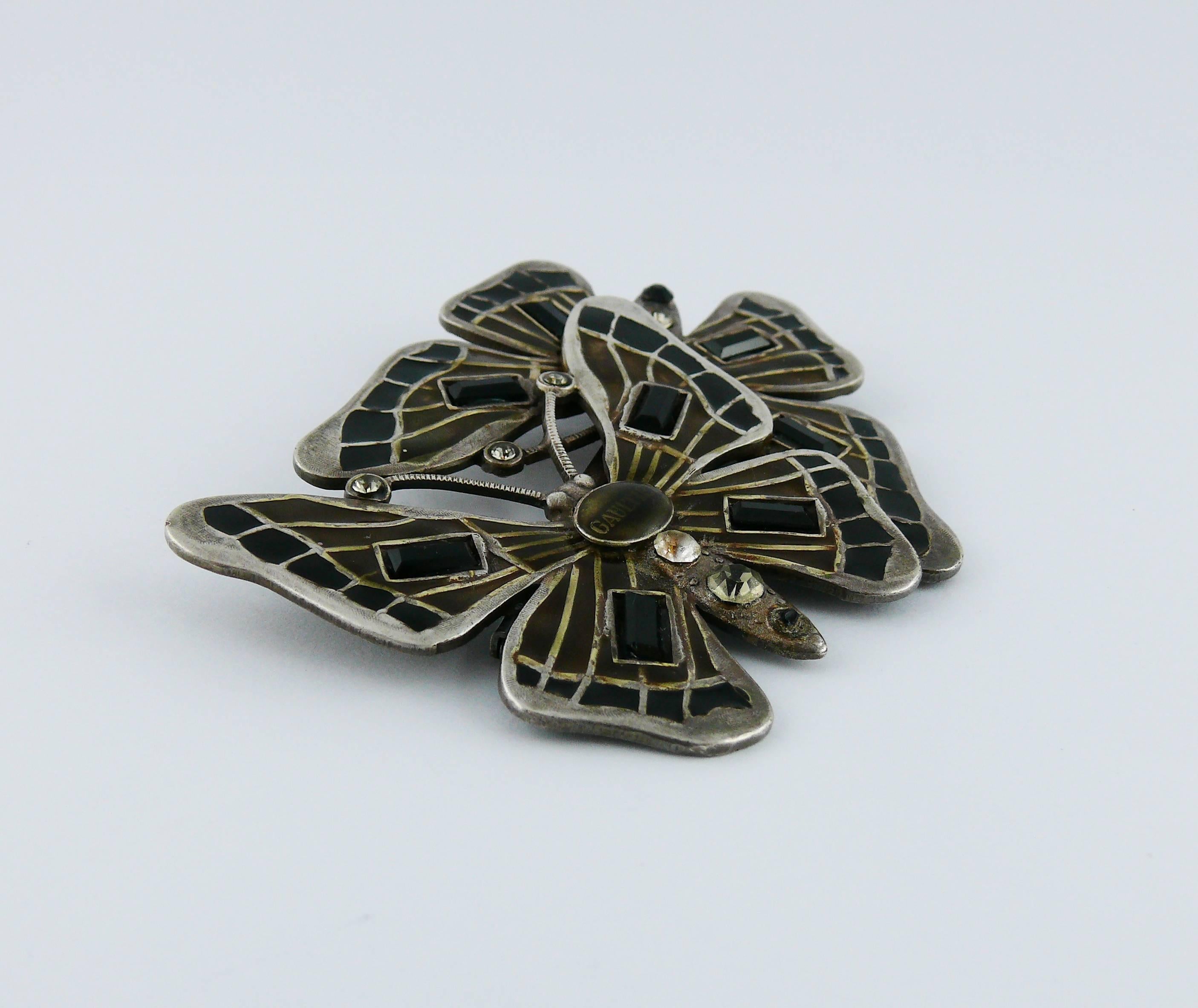 JEAN PAUL GAULTIER vintage enameled butterfly brooch with crystal embellishement.

Marked GAULTIER.

Indicative measurements : max. length approx. 5.5 cm (2.17 inches) / max. width approx. 7.3 cm (2.87 inches).

JEWELRY CONDITION CHART
- New or