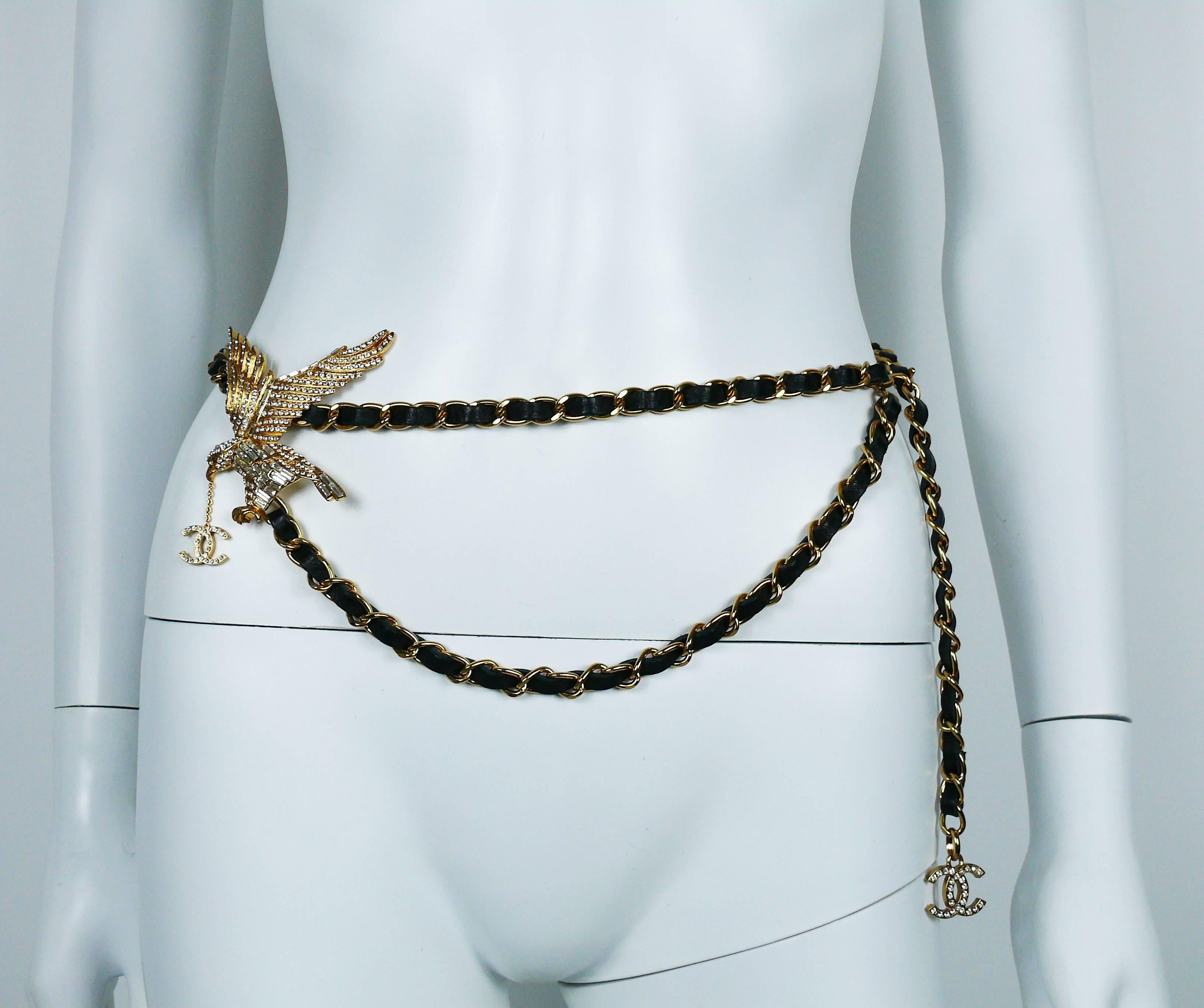 CHANEL rare gold tone chain belt with black interwoven leather featuring a large jewelled eagle.

Focal point of the CHANEL 2001 Spring runway show.

May be worn as a belt or necklace.

Hook closure.

Marked CHANEL 01 P Made in