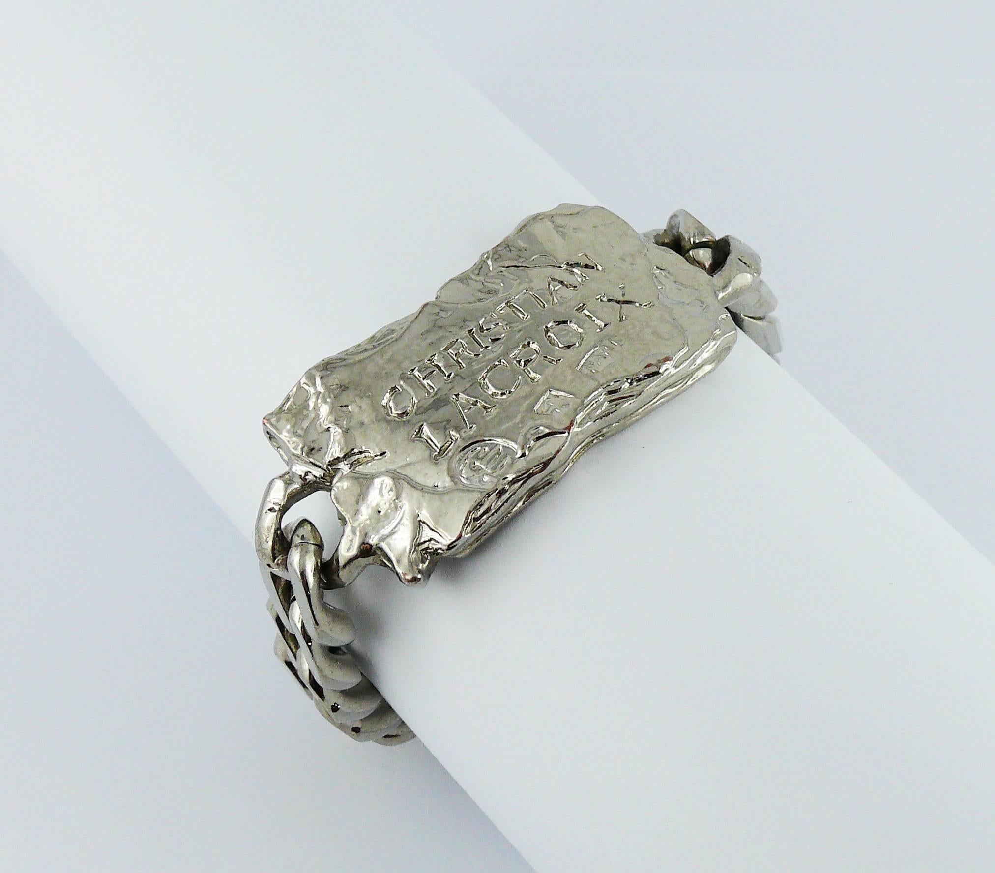 CHRISTIAN LACROIX vintage rare silver tone ID tag curb bracelet.

This bracelet features :
- Massive curb chain links
- Textured ID tag plate embossed CHRISTIAN LACROIX Paris
- Secure clasp

Marked CHRISTIAN LACROIX CL Made in France.

Indicative