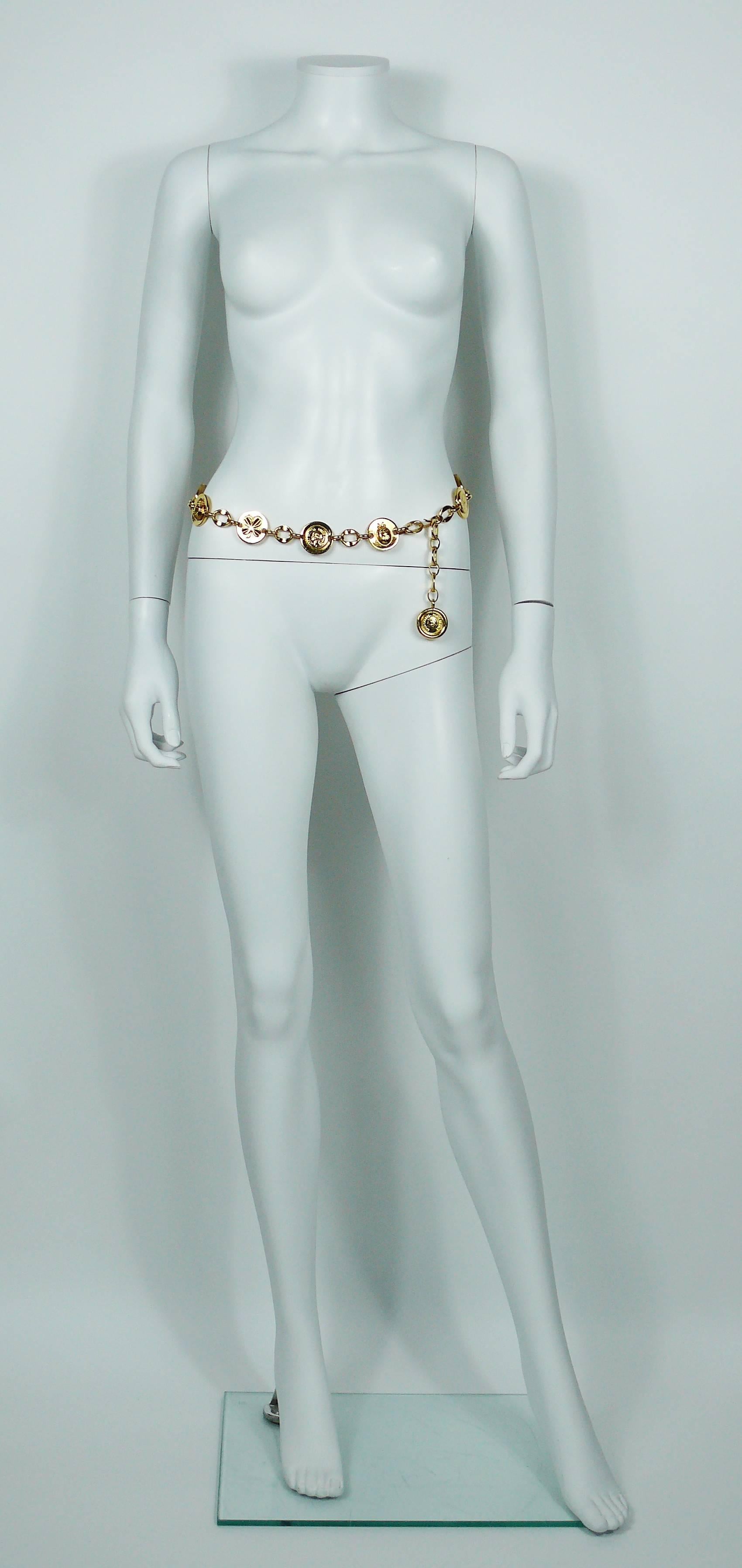CHANEL vintage gold toned chain belt featuring some iconic symbols of the House : ladybug, clover and Mademoiselle profile.

Similar model worn at CHANEL Haute Couture 1986 Spring-Summer runway show. Bibliography : 