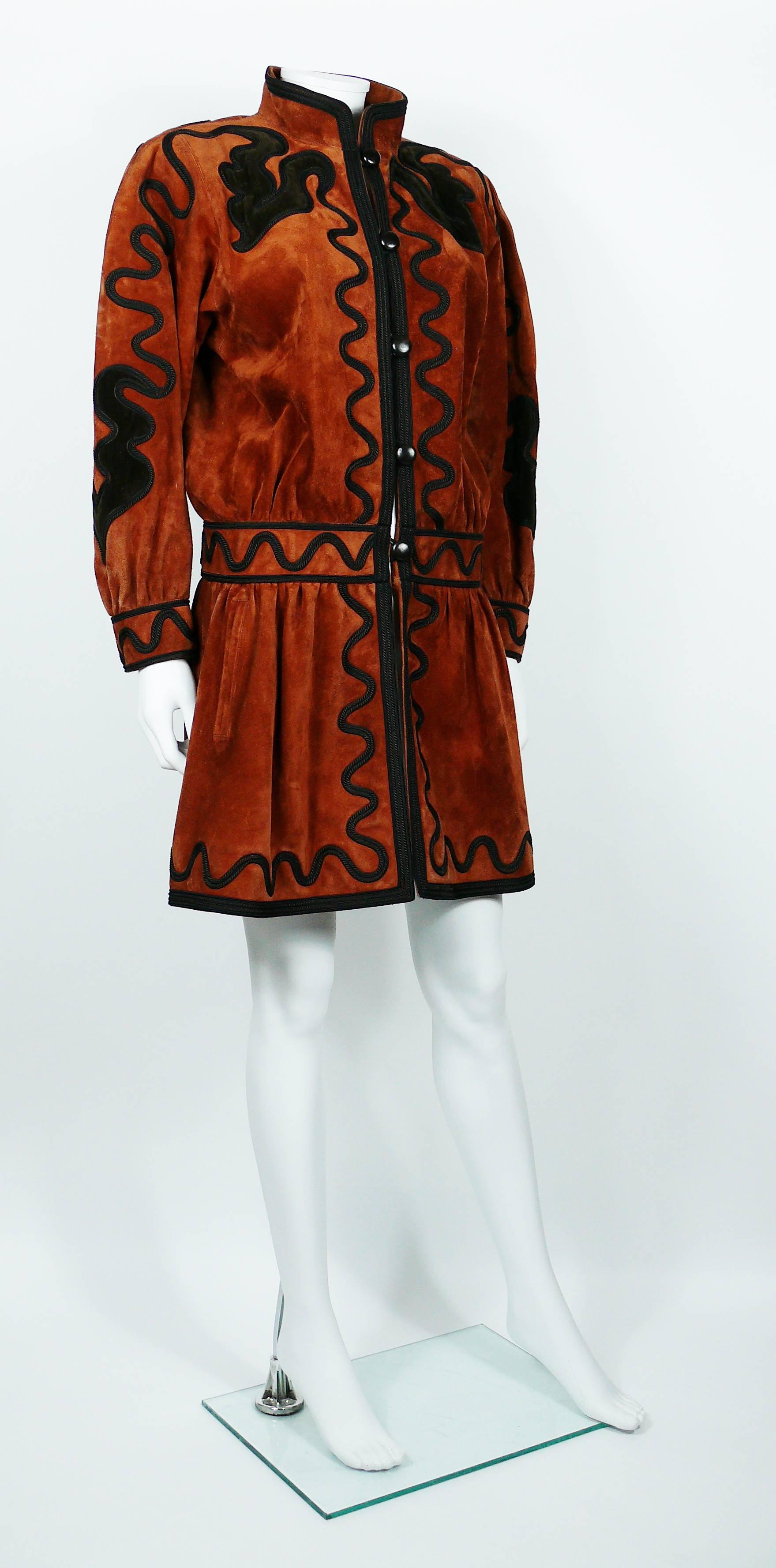 YVES SAINT LAURENT rare Haute Couture Russian inspired embroidered suede jacket from the Fall-Winter 1981-82 Collection.

This jacket features :
- Rust color suede.
- Embroideries and brown velvet inserts;
- Belted low-rise.
- Front buttoning with