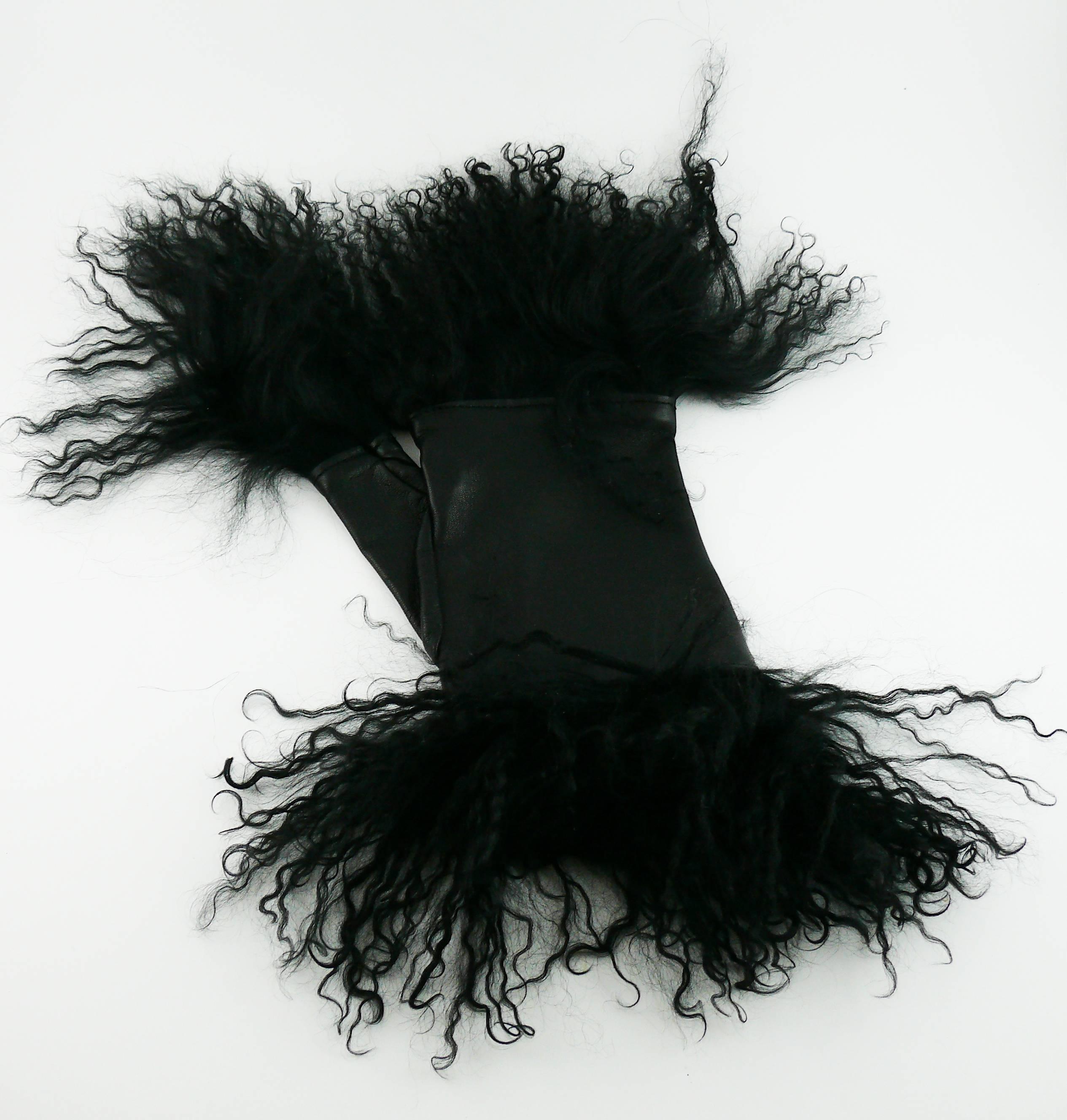 YOHJI YAMAMOTO black lambskin fingerless gloves mitts embellished with Mongolian lamb fur.

Early 2000s.
Probably from Winter 2000 Collection.

Label reads YOHJI YAMAMOTO (only attached on one glove).
Printed "Cuir Agneau" and size