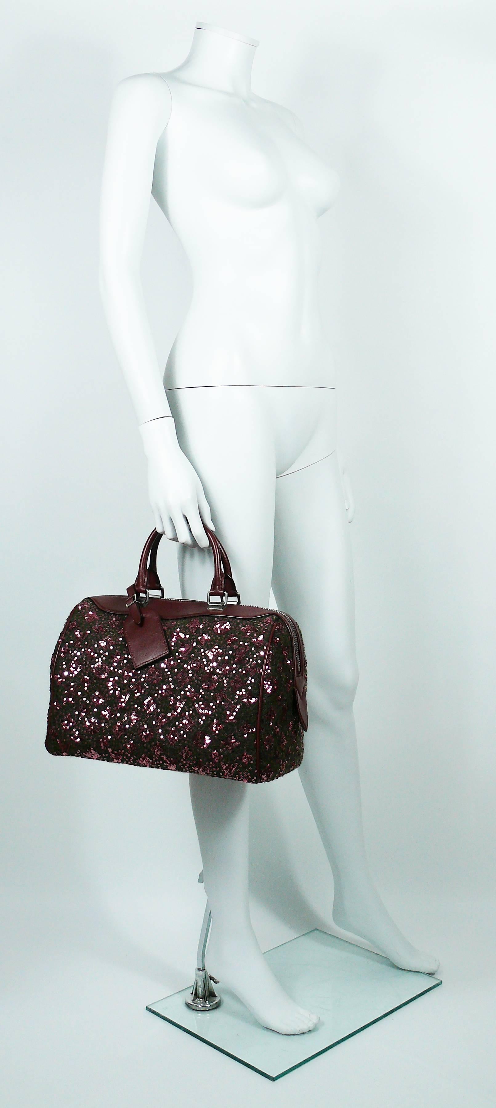 LOUIS VUITTON Limited Edition Sunshine Express Speedy.

This bag features : 
- Felted wool body with embroidered sequined iconic Monogram.
- Burgundy leather trim.
- Gun metal patina hardware.
- Dual rolled top handles.
- Burgundy fabric lining.
-