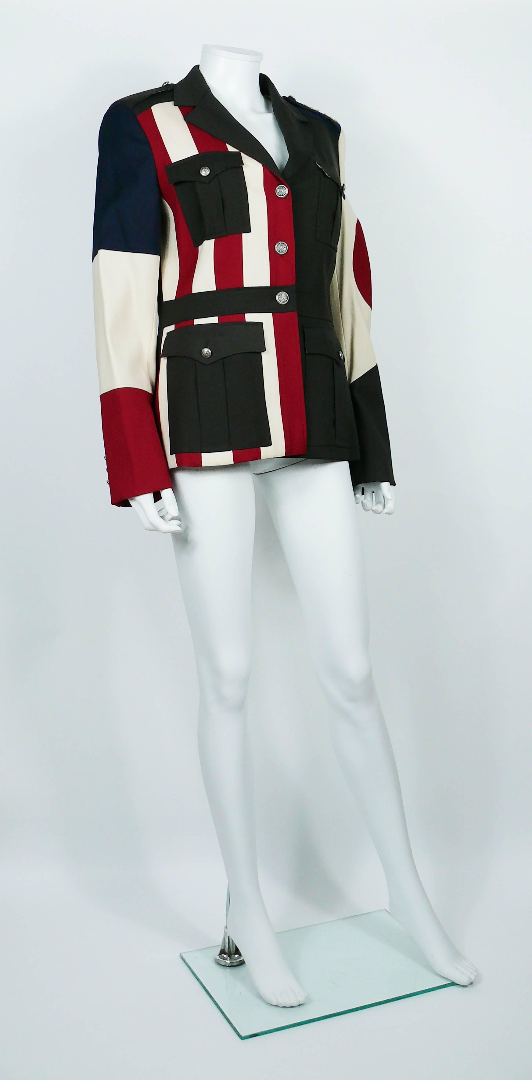 MOSCHINO military style jacket featuring a multicolored flag patchwork.

This jacket features :
- Long sleeves.
- Fully lined.
- Shoulder pads.
- 4 front pockets.
- Silver toned with antique patina buttons.
- Gold toned stars appliqués on one