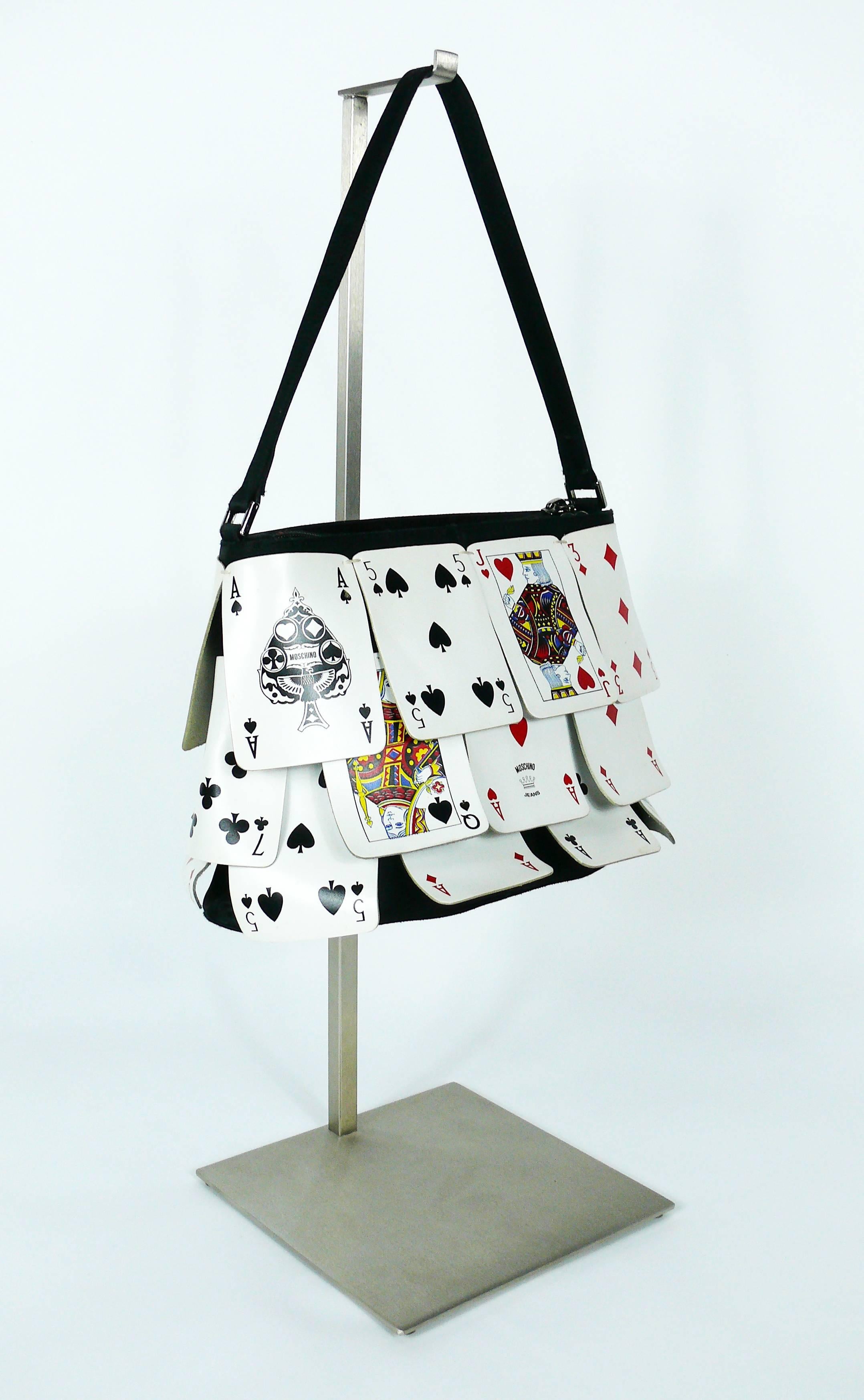 MOSCHINO vintage rare novelty playing cards bag.

This bag features :
- Black satin body overlaid with 24 playing cards.
- Red fabric lining.
- One inner zippered pocket.
- Zip closure.
- Top handle.
- Gun metal patina hardware.

Label reads :