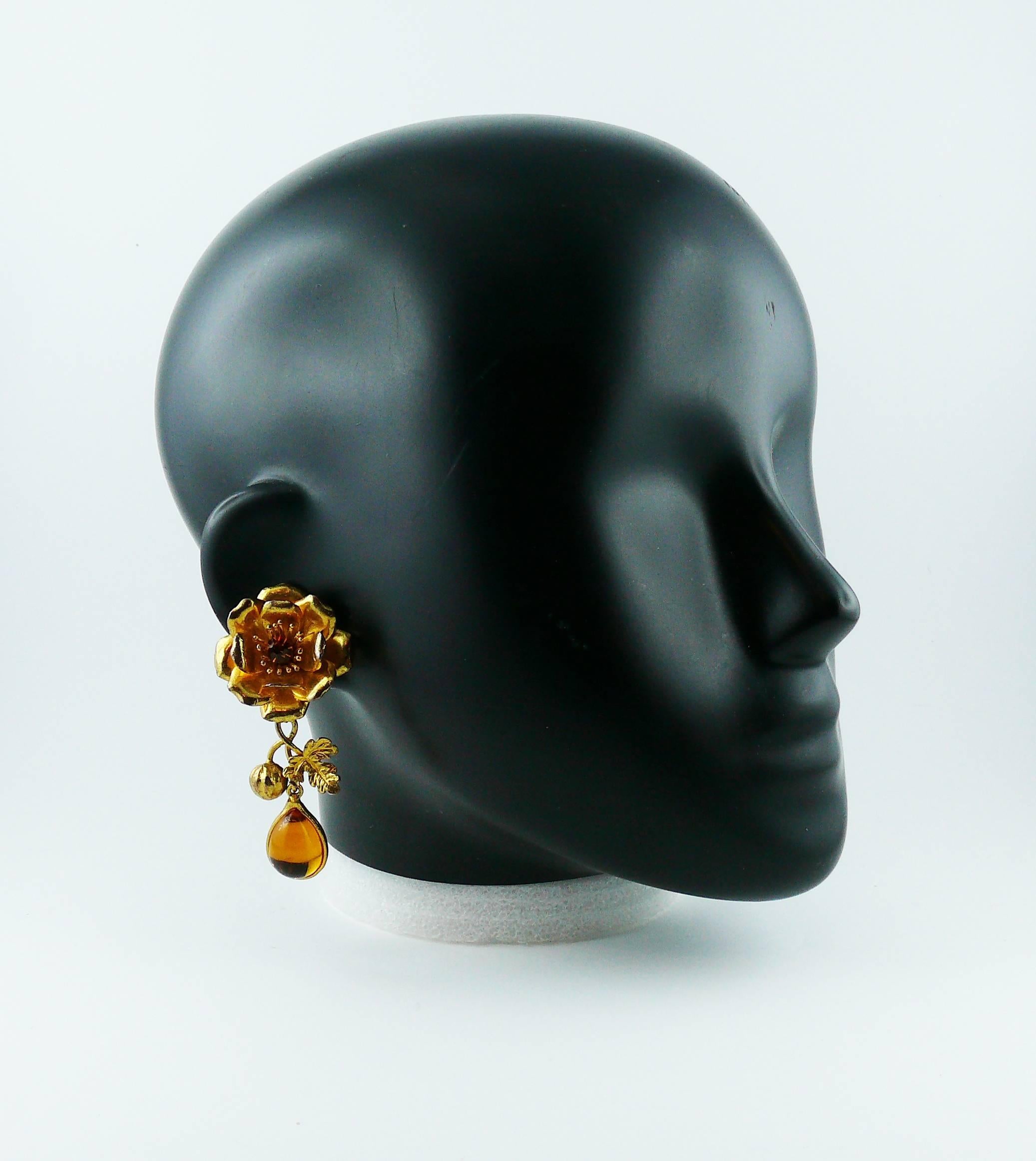 YVES SAINT LAURENT Rive Gauche gold toned floral dangling earrings (clip-on) embellished with crystal and glass cabochon.

Marked YVES SAINT LAURENT Rive Gauche Made in France.

Indicative measurements : length approx. 7.1 cm (2.80 inches) / max.
