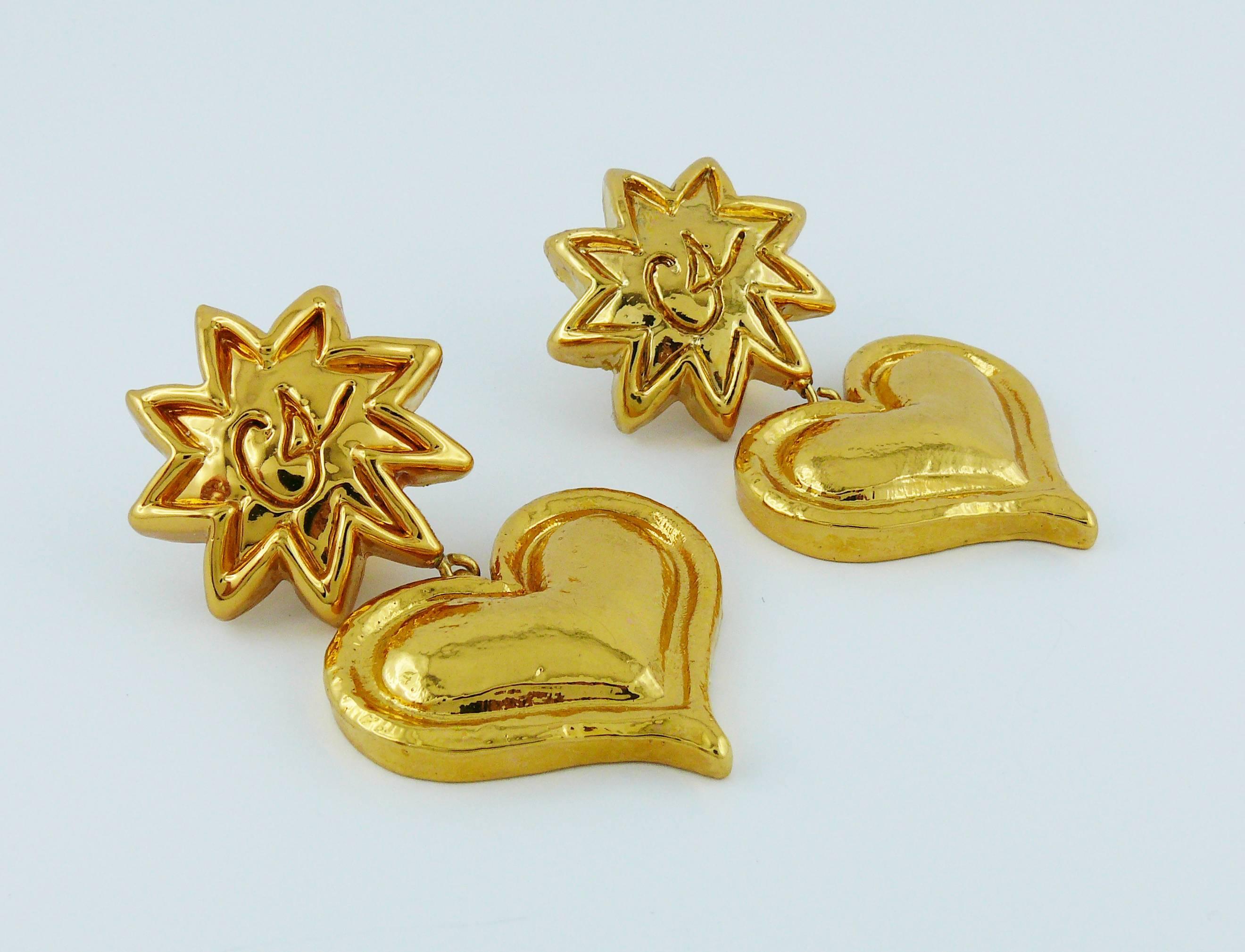 CHRISTIAN LACROIX vintage gold toned resin dangling earrings (clip-on) featuring iconic sun and heart with embossed CHRISTIAN LACROIX monogram.

Marked CHRISTIAN LACROIX CL Made in France (only on the reverse of one earring).

Indicative