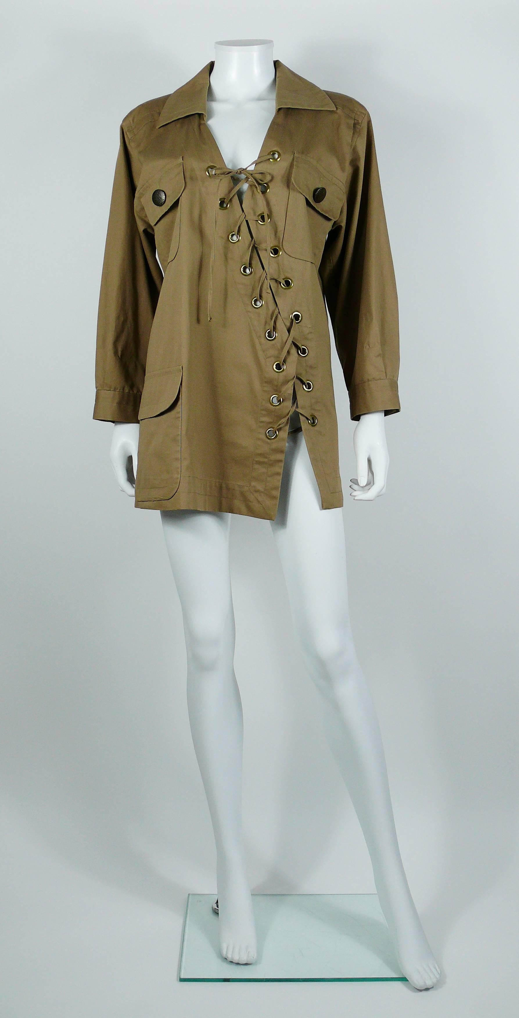 YVES SAINT LAURENT vintage beige cotton Safari tunic with asymmetric lacing.

Spring/Summer 1990 Ready-to-Wear Collection.

This tunic features :
- Asymmetric lacing.
- Long sleeves.
- Bronze color with antique patina hammered buttons.
- Metal