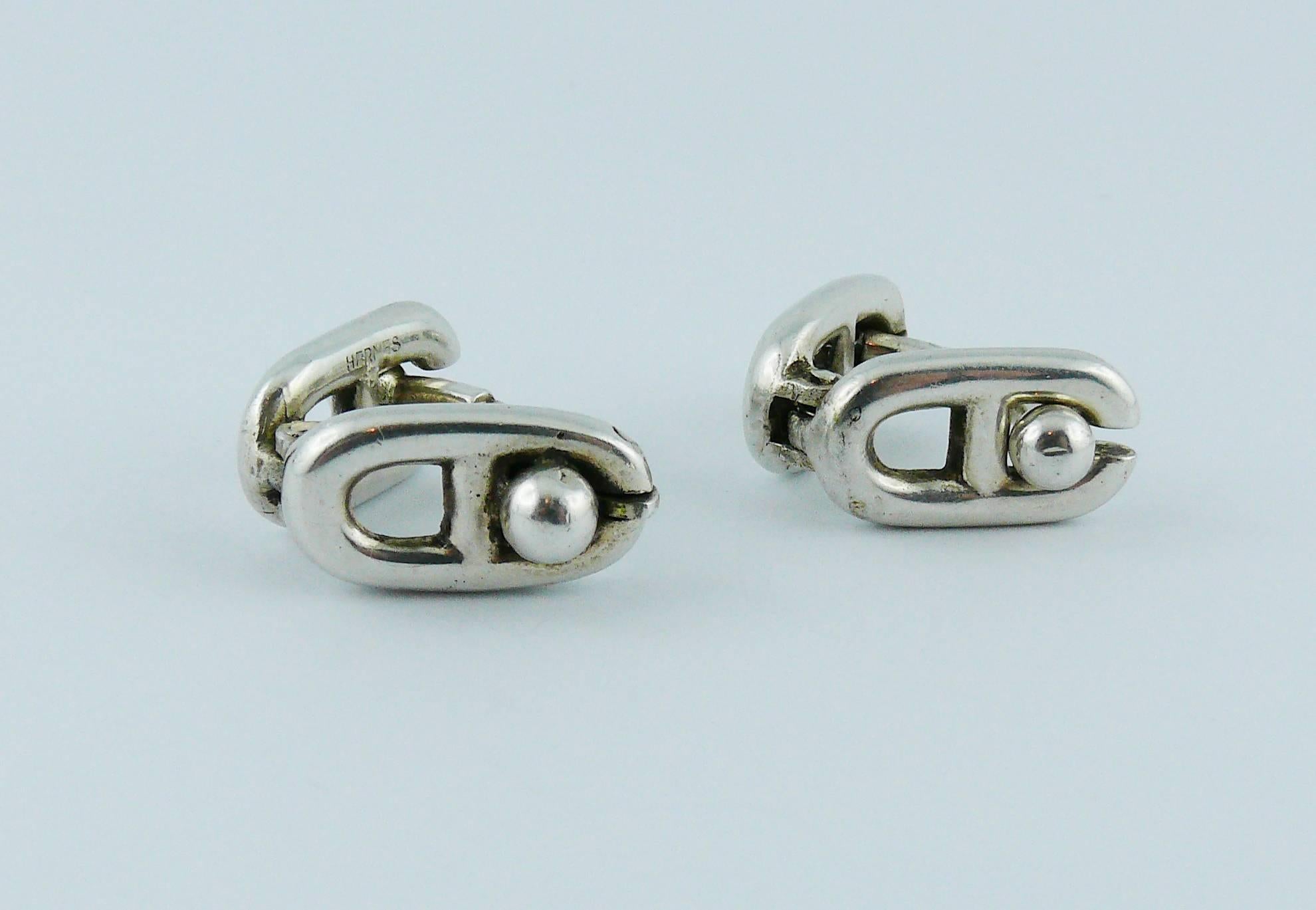 HERMES vintage "Chaine d'Ancre" silver cufflinks.

Embossed HERMES and numbered on one cufflink (the other has no HERMES marking).
Both cufflinks have French silver hallmark "Crab".

Indicative measurements : max. height approx.