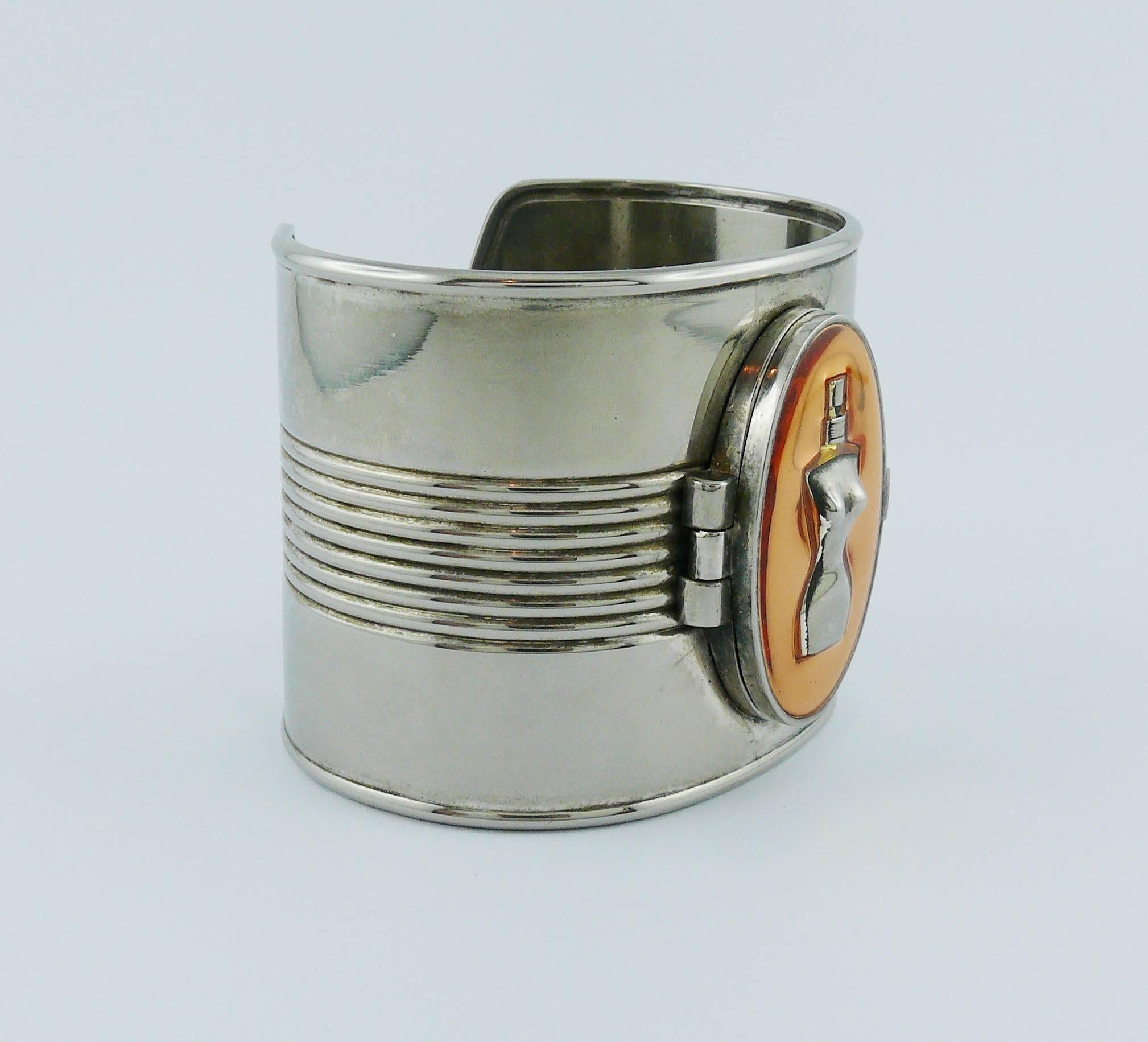 JEAN PAUL GAULTIER iconic tin can cuff bracelet in silver tone with antiqued patina.

Promotional bracelet JEAN PAUL GAULTIER Parfums.
Still with untouched solid perfume (oder faded).

Indicative measurements : inner measurements approx. 6.5 cm x