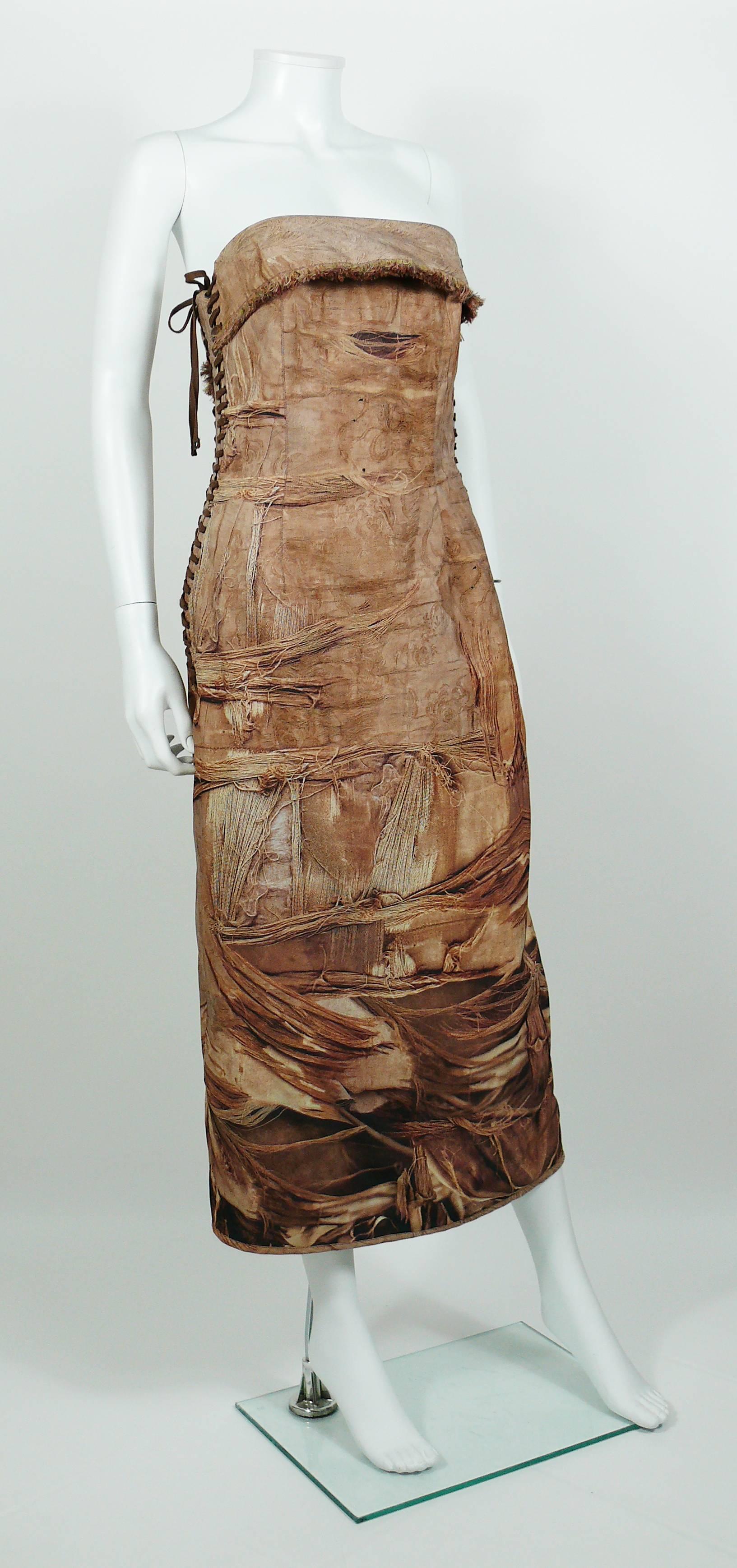 JEAN PAUL GAULTIER stunning bustier dress featuring a torn and stained antique fabric trompe l'oeil print.

This dress features :
- Boned chest.
- Lace detail on both sides.
- Passementerie trim on bustier.
- Slit on back.
- Zippered back closure.
-