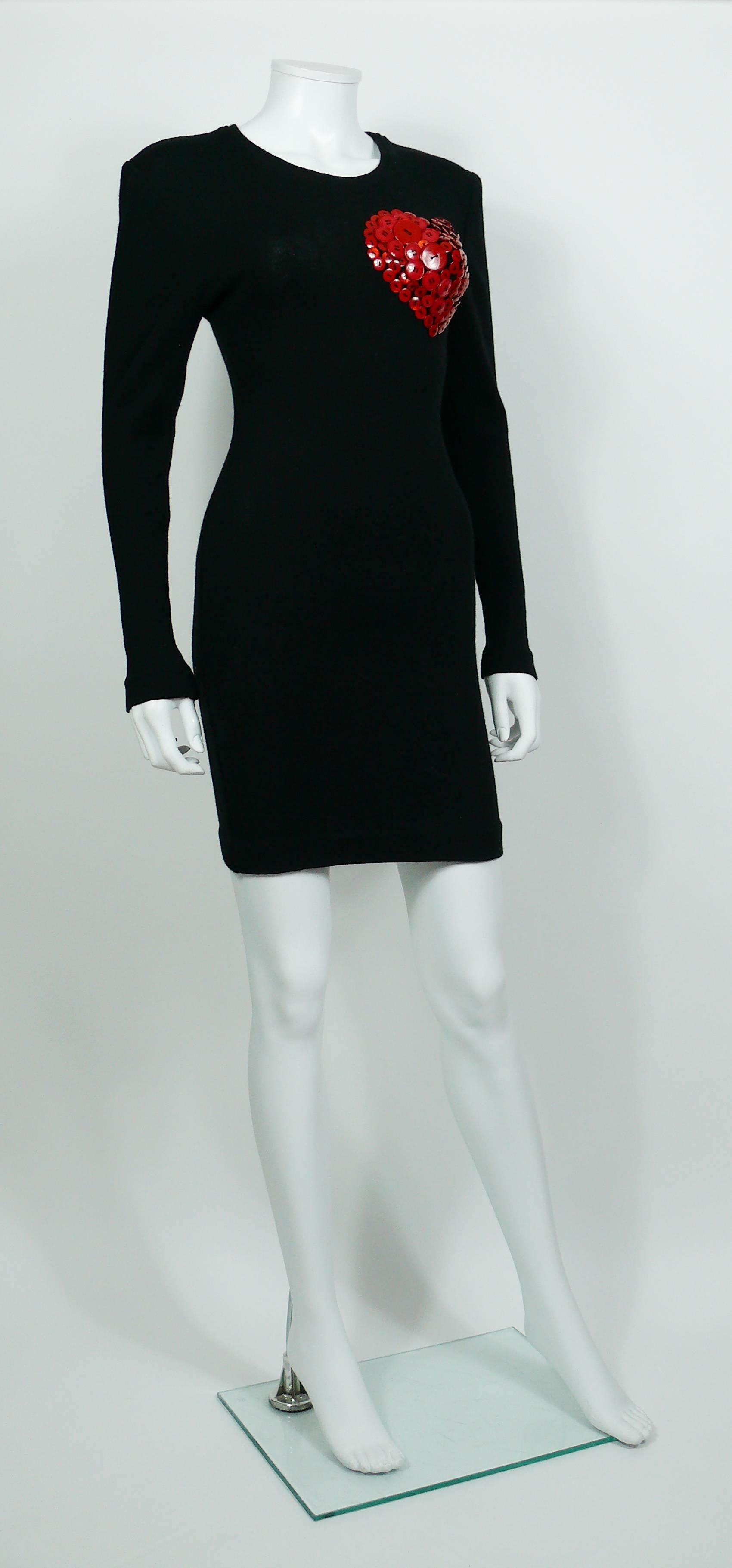PATRICK KELLY vintage black wool little knit dress featuring a large iconic red button heart on breast.

Circa 1986.

Label reads PATRICK KELLY Paris.
Made in France.

Size tag reads : 1.
Please refer to measurements.

Composition label reads : 100%