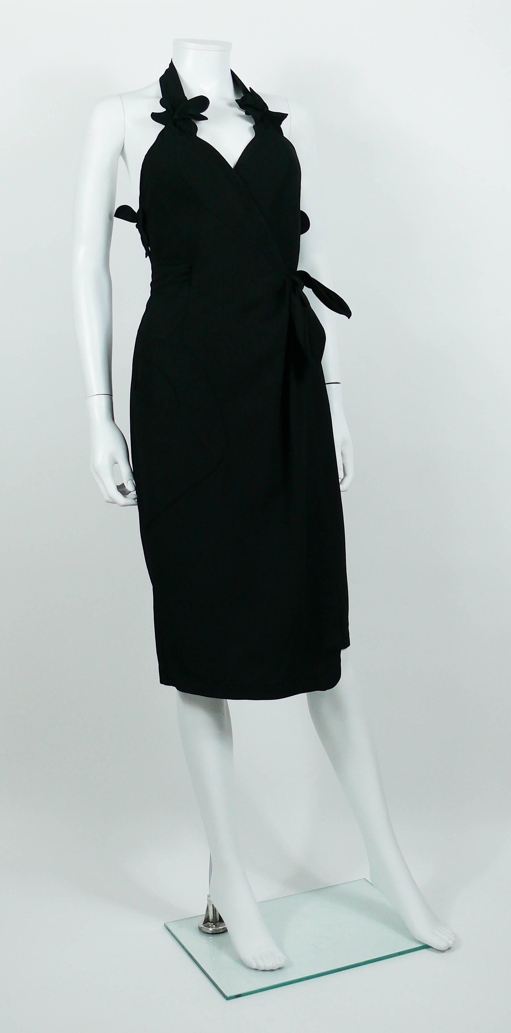 THIERRY MUGLER vintage black halter dress with gorgeous floral appliqué detail and back.

Wrapped waist construction.
Asymetric front pocket.

Label reads THIERRY MUGLER Paris Made in France.

Size label reads : 38.

Indicative measurements taken
