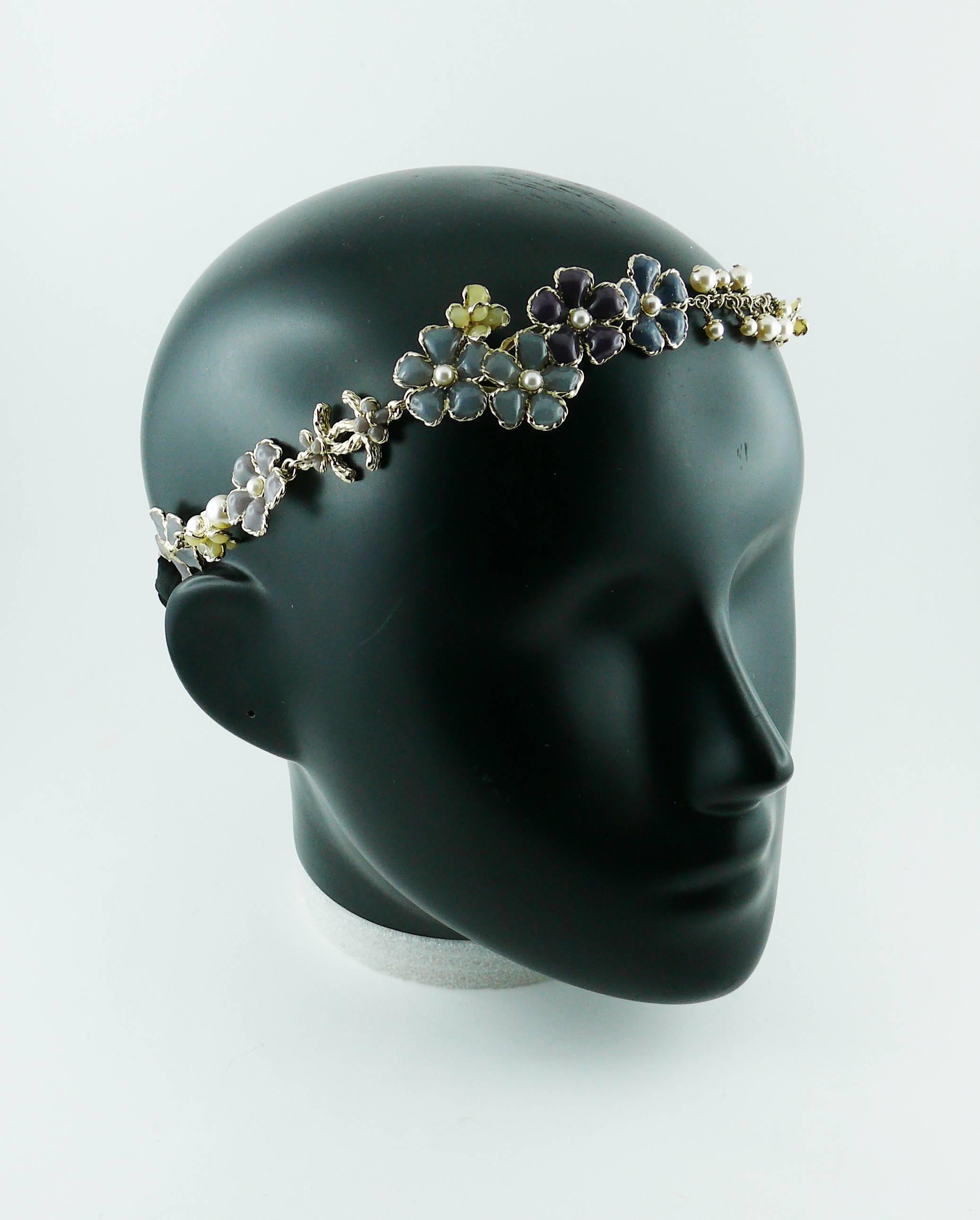 CHANEL rare and gorgeous headband featuring CC logo, muticolored flowers and faux pearls in a very pale gold toned setting.

Cruise Collection 2012-2013.

Marked CHANEL A12 C Made in France.
"S" mark for private sale (invisible when