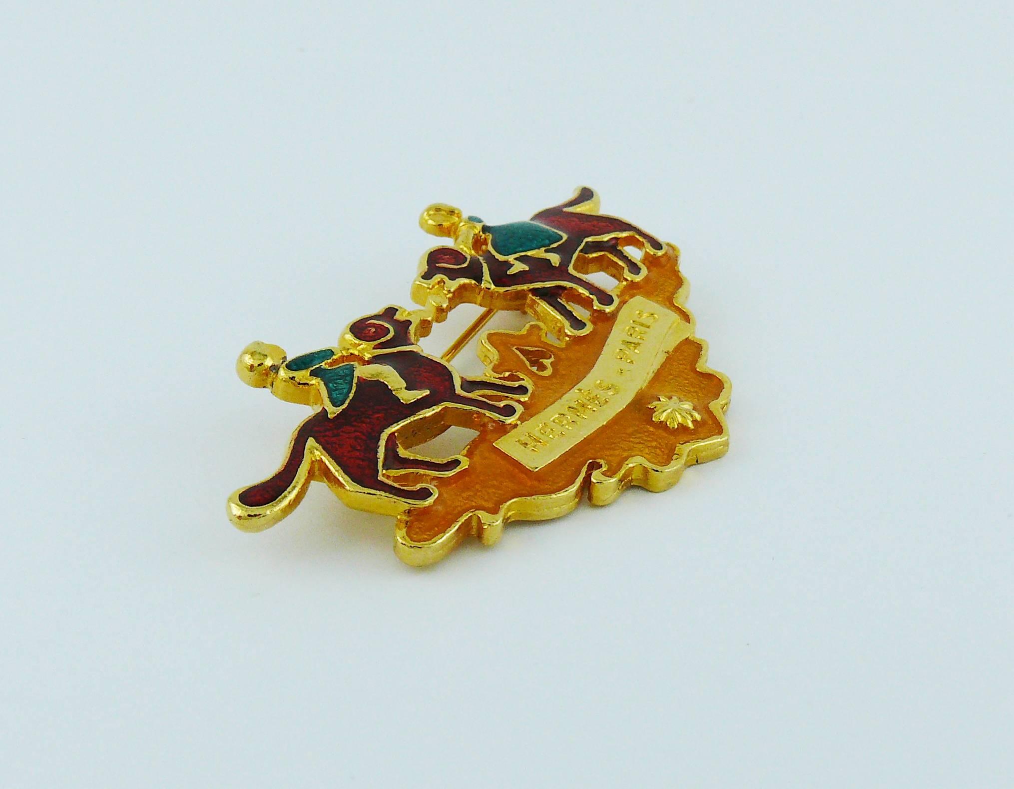 HERMES Paris gold toned brooch with multicolor enamel featuring children and dogs.

Embossed HERMES PARIS.

Indicative measurements : max. width approx. 6.2 cm (2.44 inches)/ height approx. 3.5 cm (1.38 inches).

JEWELRY CONDITION CHART
- New or