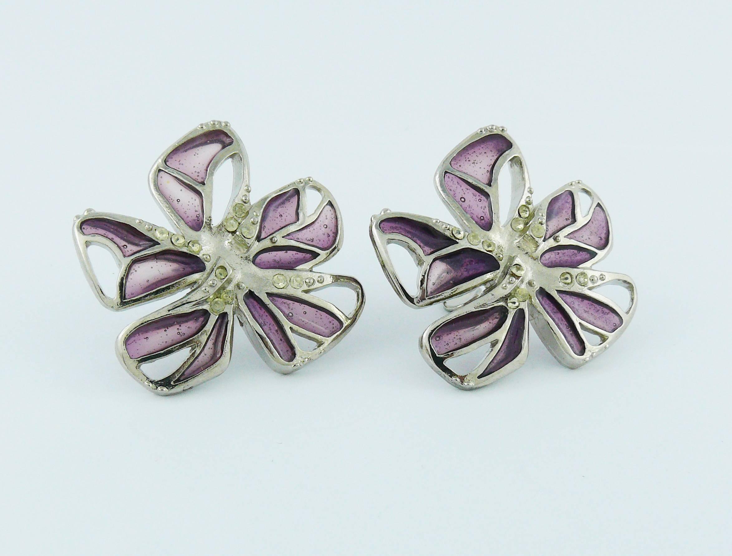 CHRISTIAN LACROIX silver toned clip-on earrings embellished with purple resin "stained glass" like.

Embossed CL France.

Indicative measurements : height approx. 3.3 cm (1.30 inches) / max. width approx. 3.6 cm (1.42 inches).

JEWELRY