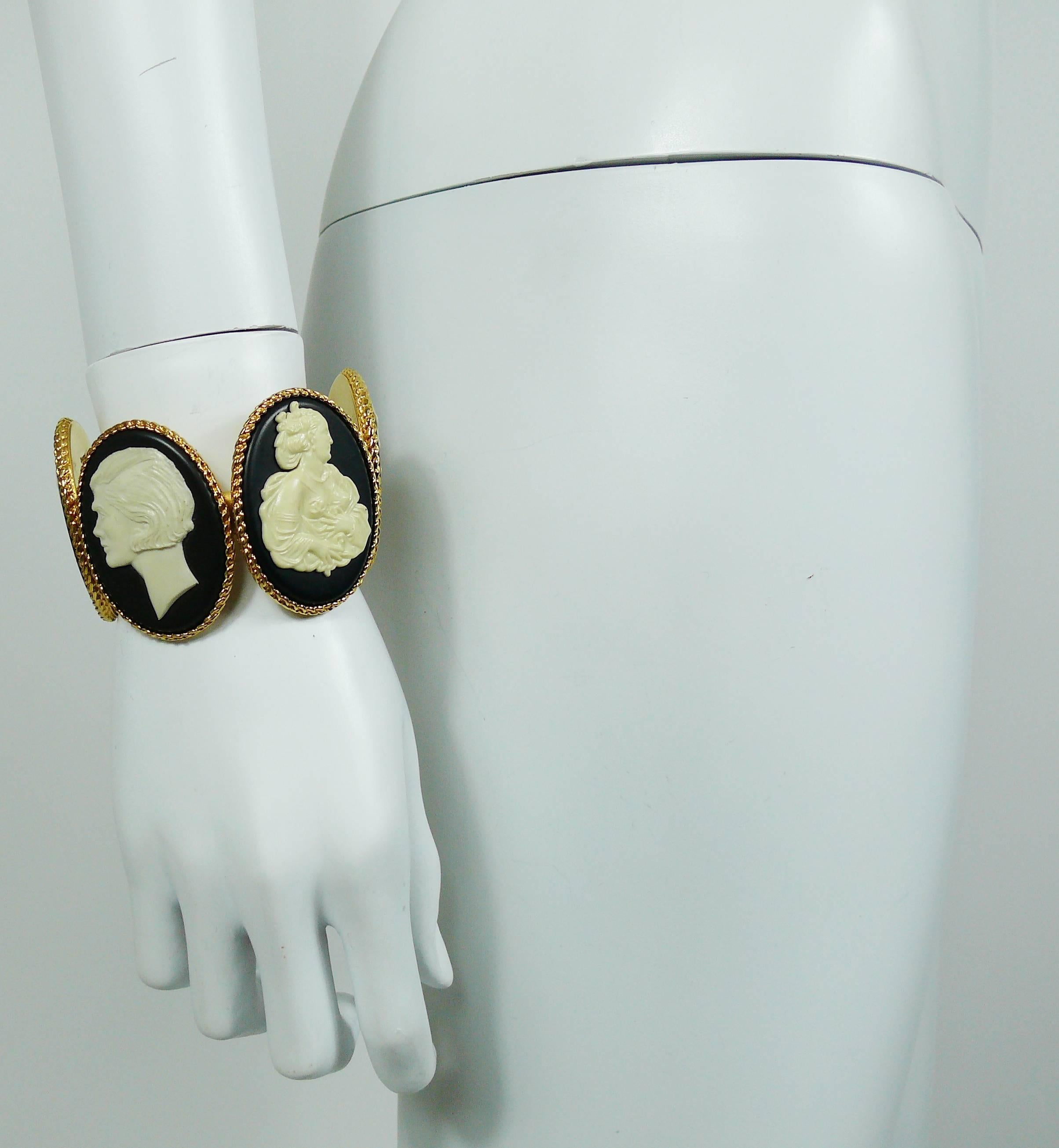 CHANEL vintage uber rare cuff bracelet featuring four large size resin oval cameos (off-white on a black background) in a gold toned setting.

Two cameos feature Mademoiselle CHANEL profile.

A truly collector item, impossible to find !

Embossed