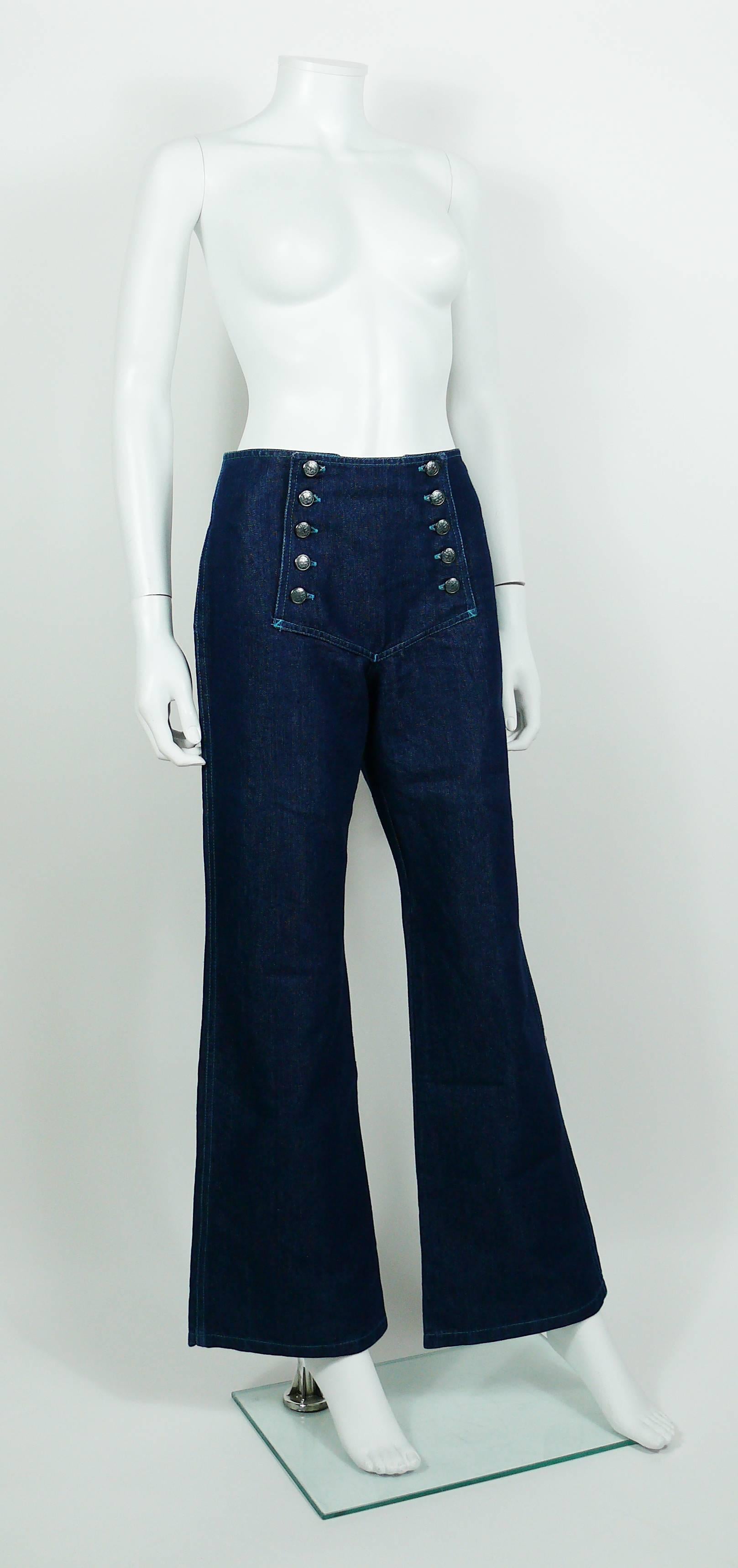 JEAN PAUL GAULTIER vintage iconic sailor blue jeans featuring logo button fastening apron to the front.

Label reads GAULTIER JEAN'S Haute Jeanerie Tailored.
Made in Morocco.

Size tag reads : 38.
Please refer to measurements.

Composition tags read
