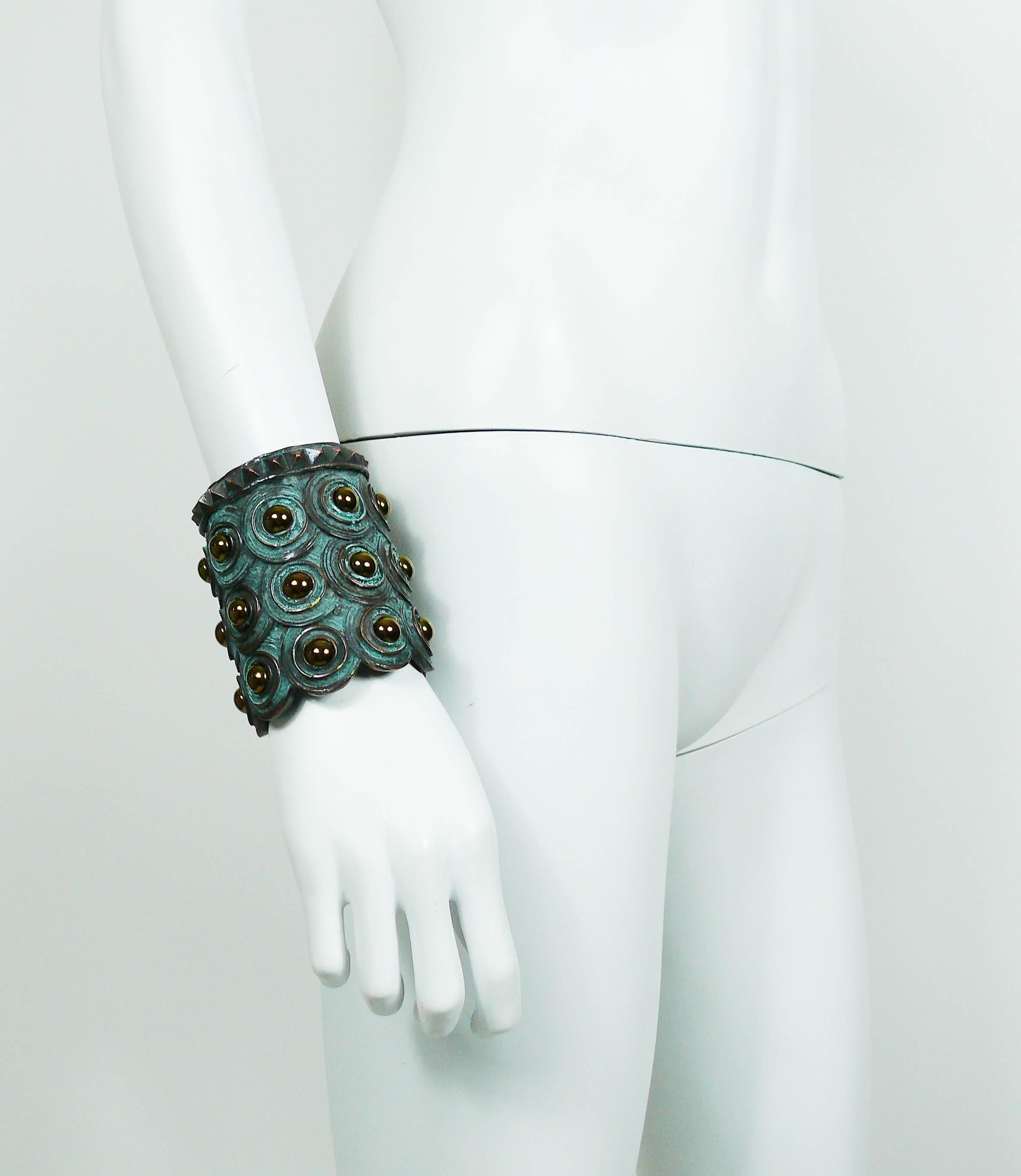 Vintage runway bracelet cuff featuring a resin body with studded concentric design and oxidized bronze patina.

Unsigned.
Runway piece.

Provenance : JUN INOUE - Studio Chef at JEAN PAUL GAULTIER SA (1981-1989) - Head of the JEAN PAUL GAULTIER