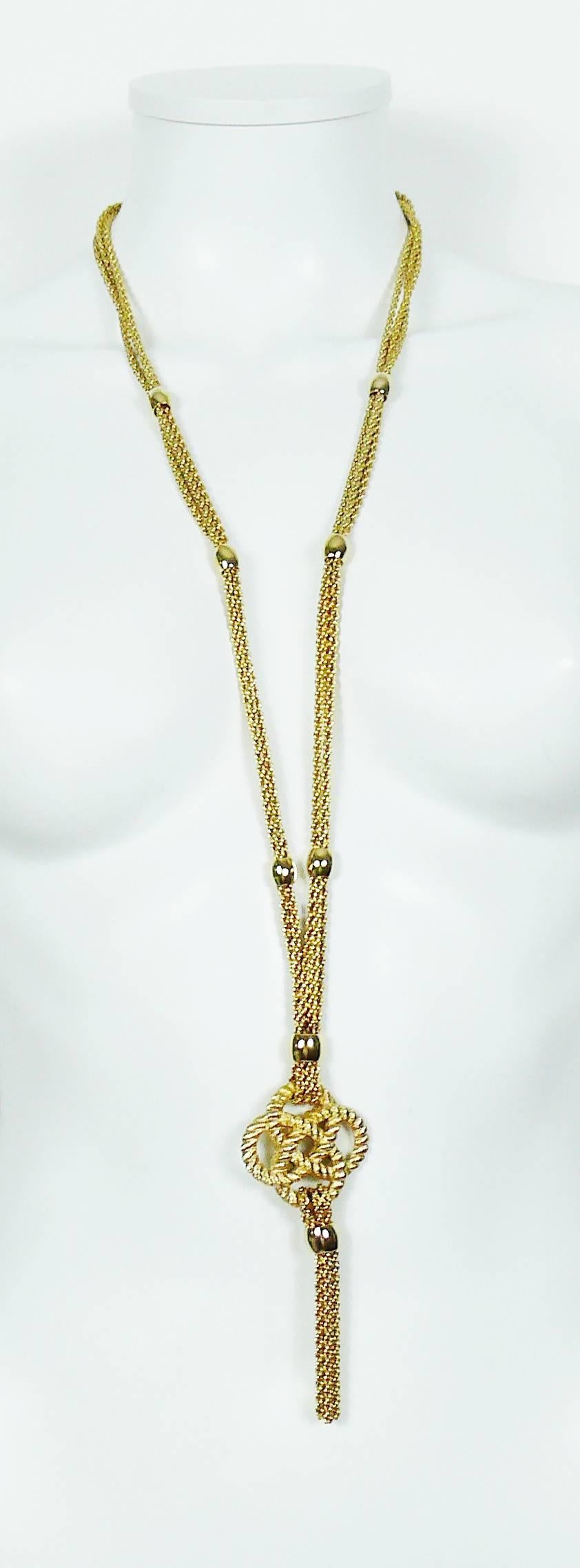 CHRISTIAN DIOR vintage multi chain gold toned sautoir necklace featuring a rope design and tassel pendant.

Marked CHR. DIOR ©.

CD secure clasp closure.

Indicative measurements : chain length approx. 87 cm (34.25 inches).

JEWELRY CONDITION