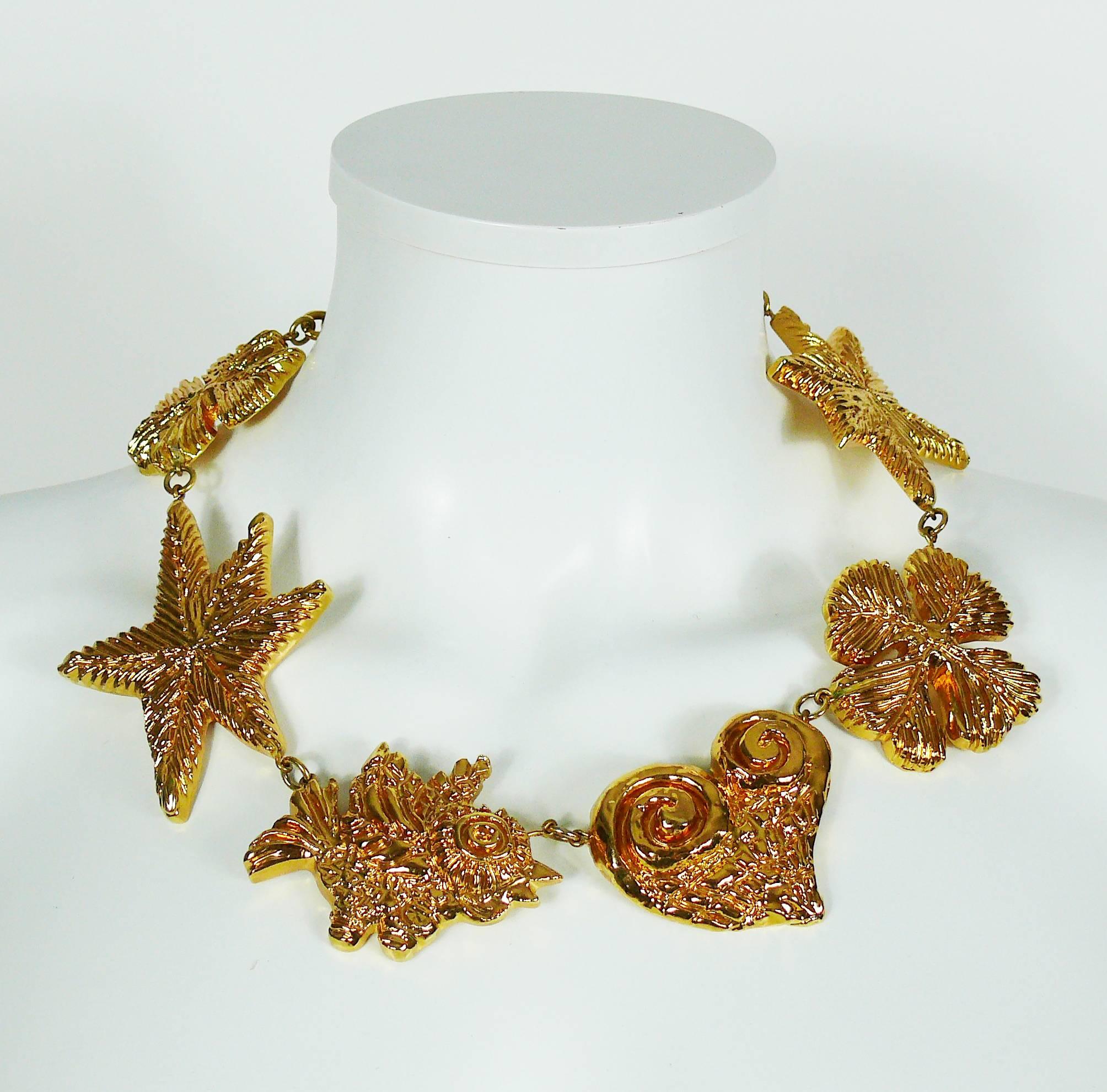 CHRISTIAN LACROIX vintage massive gold toned necklace consisting of six large resin iconic links featuring clovers, stars, heart and bird.

Hook clasp closure.
Extension chain.

Marked CHRISTIAN LACROIX CL Made in France.

Indicative measurements :