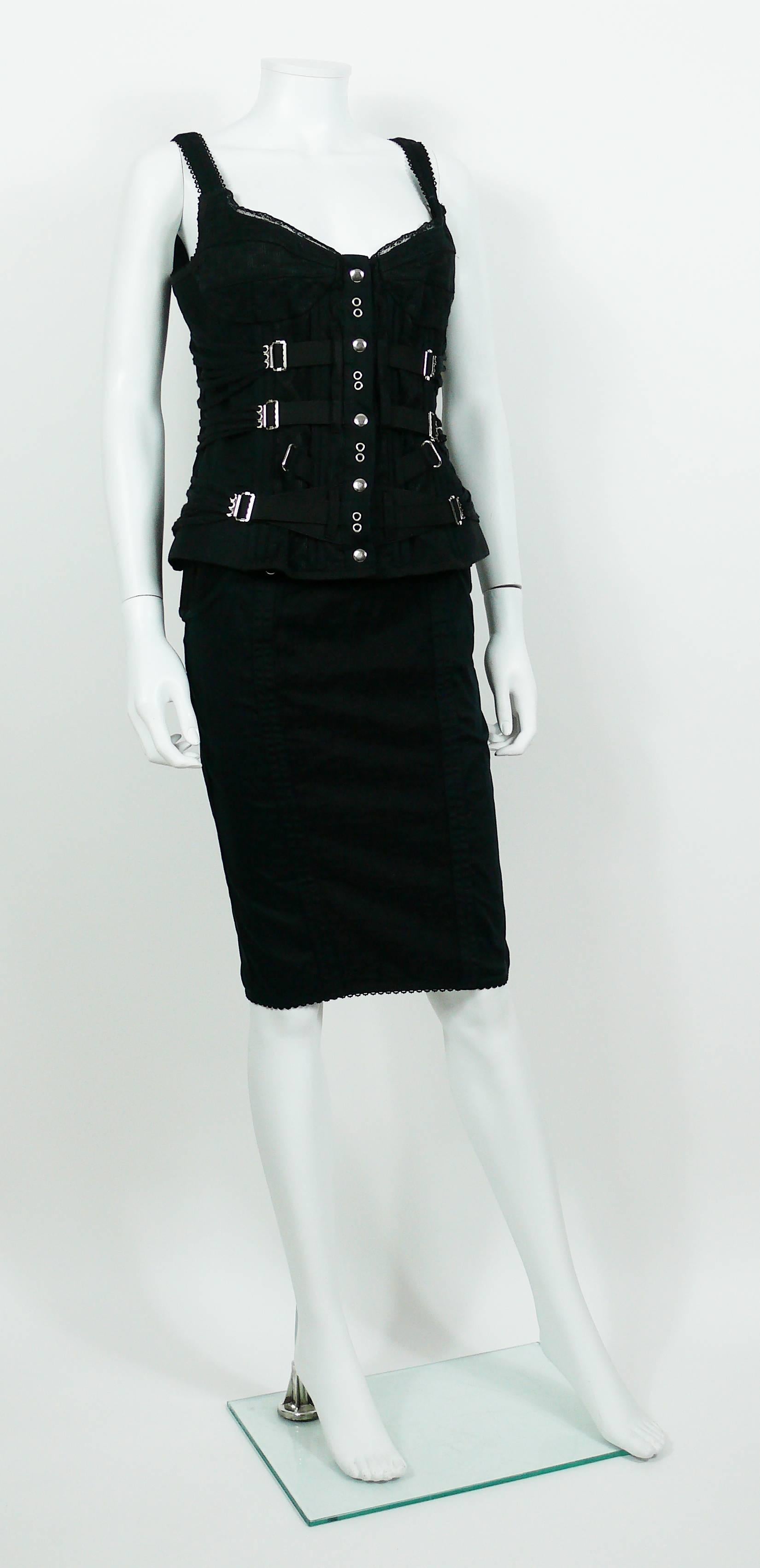 DOLCE & GABBANA D&G vintage bondage strap black skirt and bustier top ensemble.

BUSTIER features :
- Lace trim.
- Front snap buttoning.
- Boned front and back.
- Lace and strap detail at front and side.
- Stretchy textile.
- Silver toned