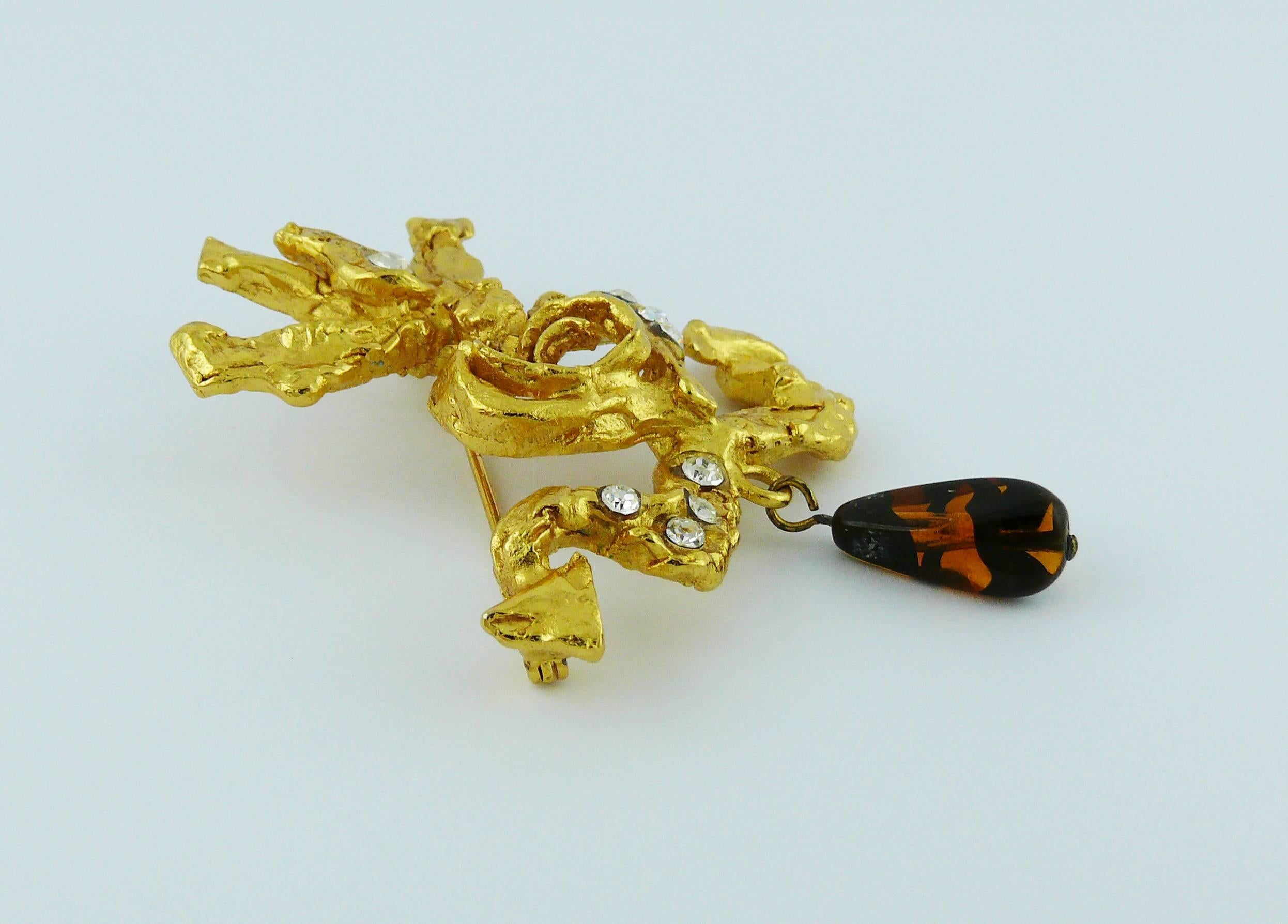 CHRISTIAN LACROIX vintage gold toned Camarguaise cross embellished with clear crystals and glass bead drop.

Marked CHRISTIAN LACROIX CL Made in France.

Indicative measurements : height approx. 6.8 cm (2.68 inches) / max. width approx. 4.9 cm (1.93