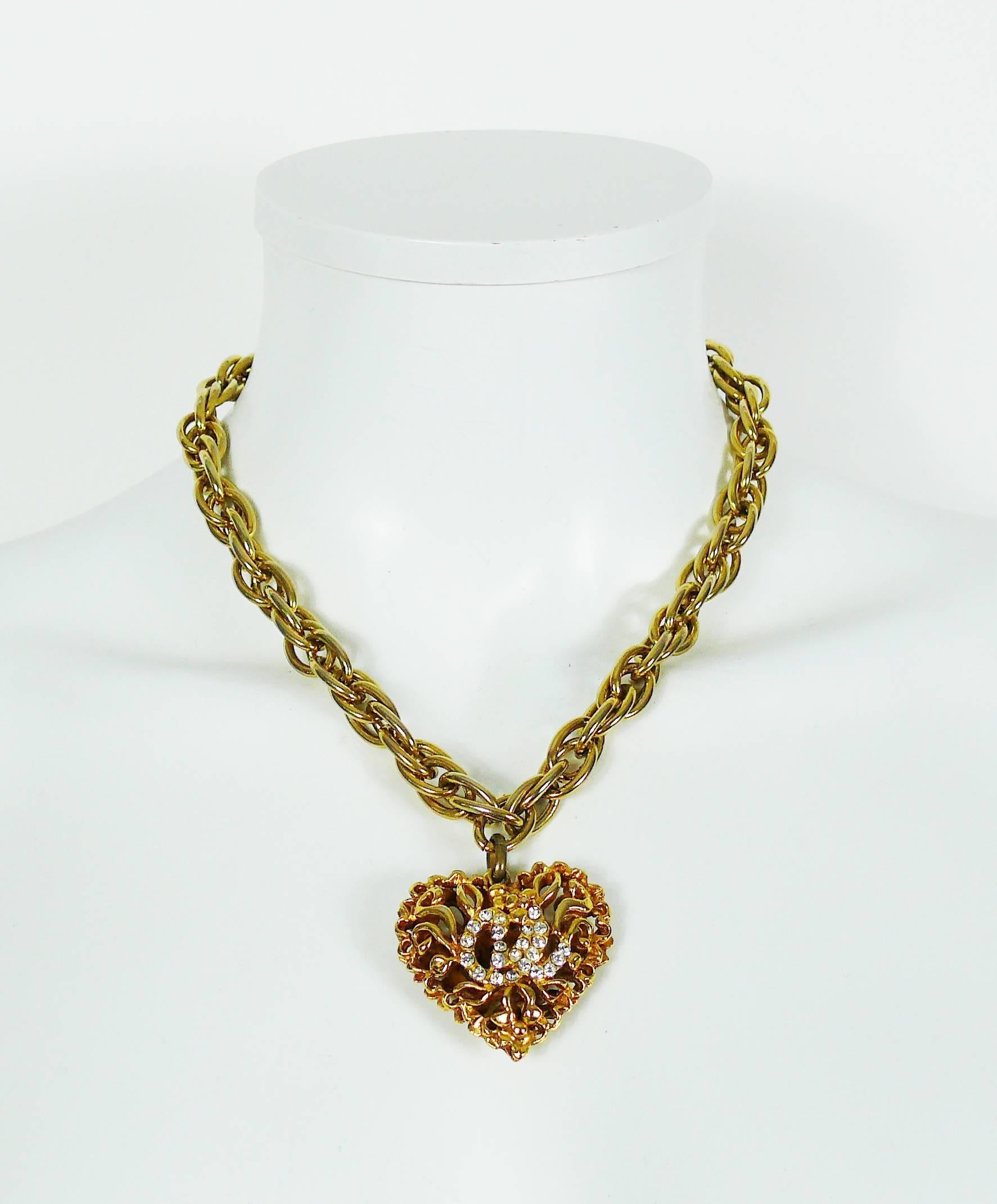 CHRISTIAN LACROIX vintage gold toned necklace featuring a chunky chain with an openwork heart pendant embellished with clear crystals and CL monogram.

Hook clasp.
Extension chain.

Indicative measurements : chain total length approx. 45 cm (17.72