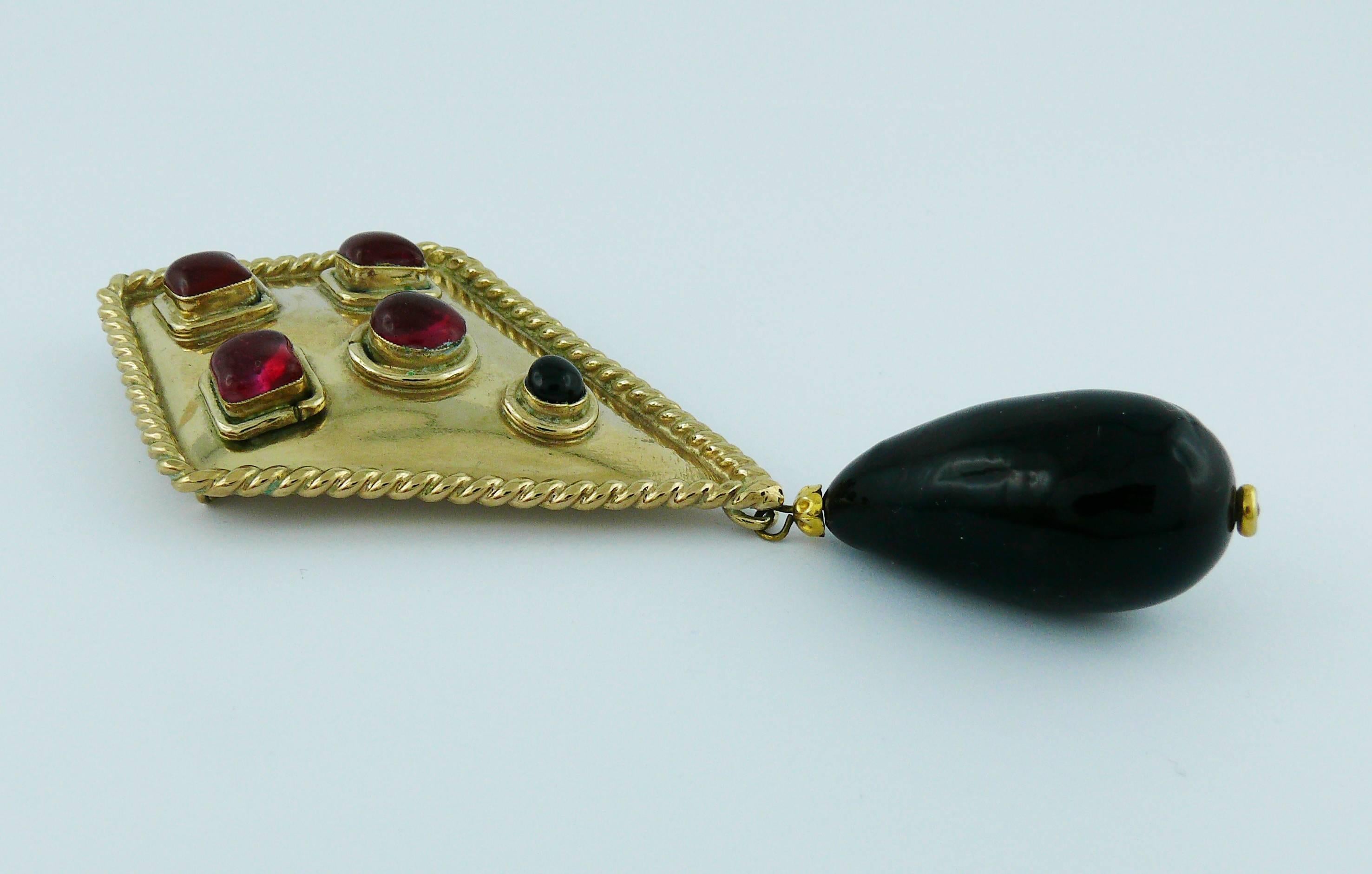 ISABEL CANOVAS vintage rare massive gold tone shield shaped brooch featuring GRIPOIX glass cabochons and a large black glass drop.

Embossed ISABEL CANOVAS.

Indicative measurements : max. height approx. 11.2 cm (4.41 inches) / max. width approx. 5