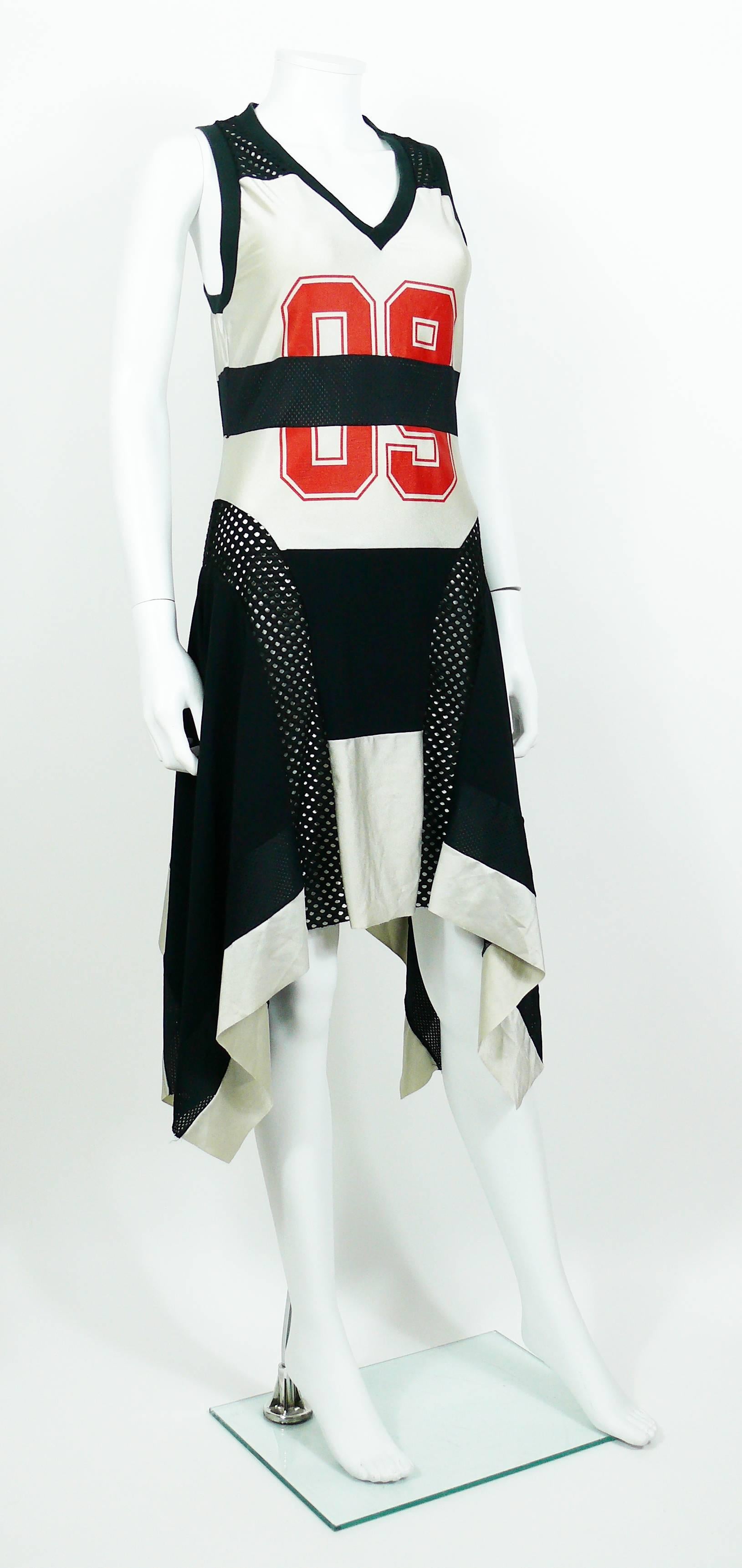 JEAN PAUL GAULTIER black and grey colour block basketball jersey asymetrical dress.

This dress features :
- V-neck.
- Racer back.
- Openwork mesh paneling to the front and rear.
- Large red 